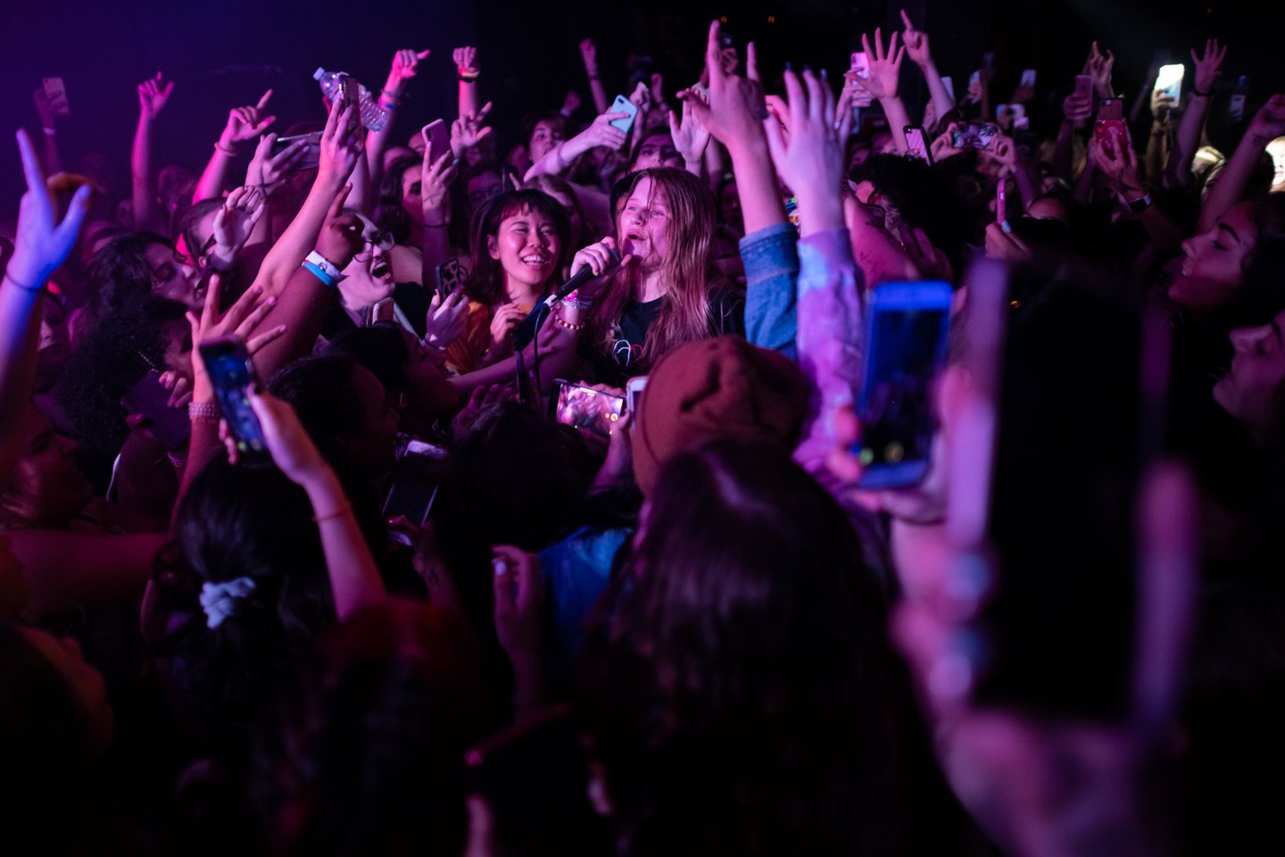  Norwegian musician girl in red performs surrounded by fans after crowd surfing, at U Street Music Hall, in Washington, D.C., on September 9, 2019. (Photo by Graeme Sloan) 