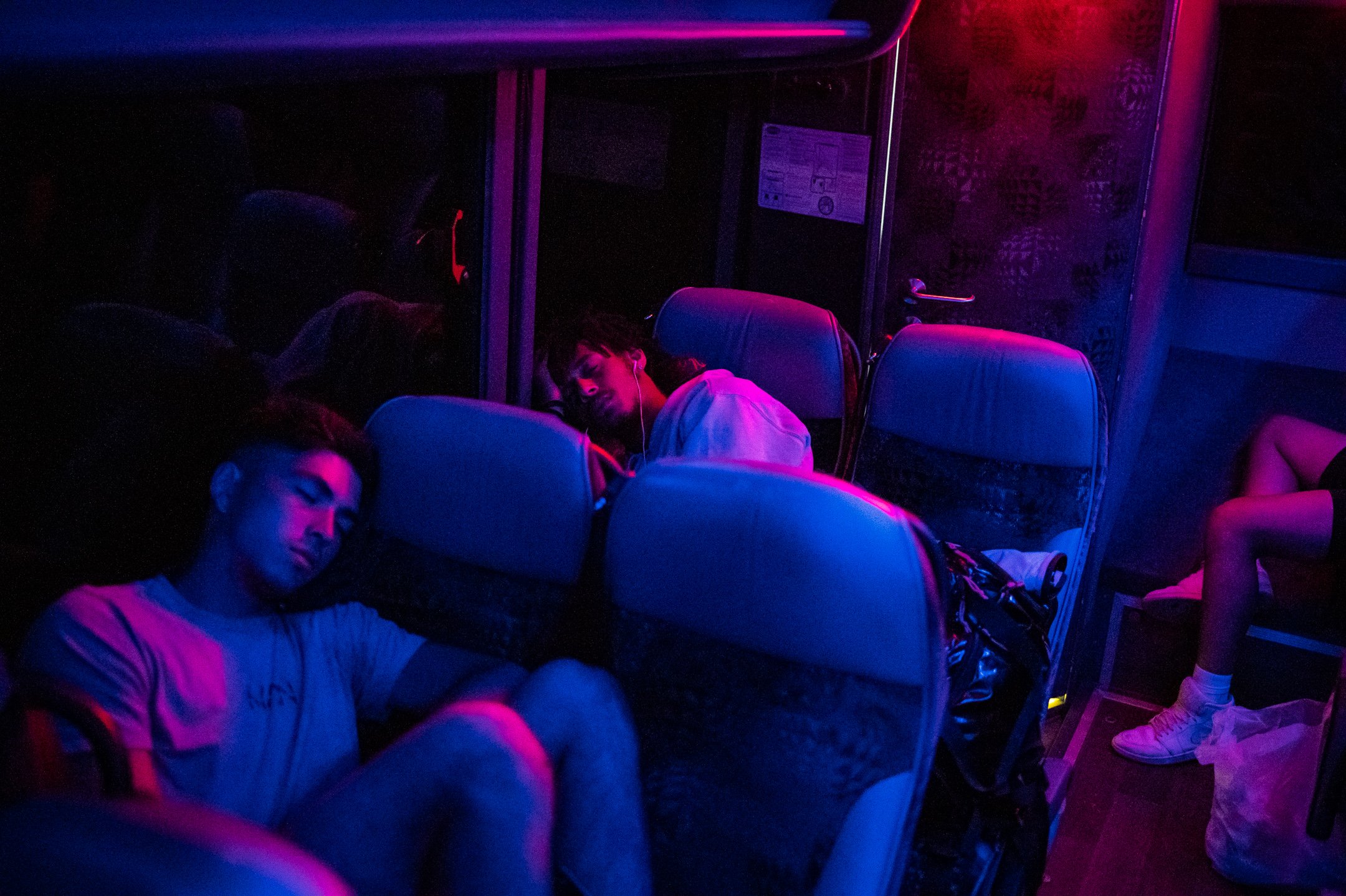 DC Breeze player AJ Merriman and teammates sleep on a late night bus after an away loss to the New York Empire, overnight in transit to Washington, D.C., on June 5, 2021. (Graeme Sloan for The Washington Post Magazine) 