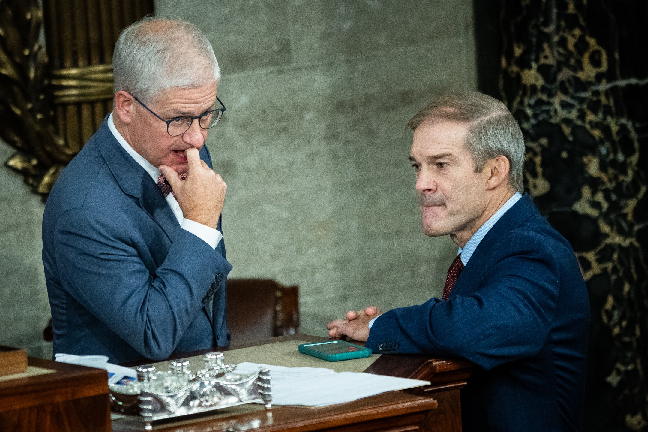  Representative Patrick McHenry (R-N.C.), the Speaker Pro Tempore of the House, speaks with Representative Jim Jordan (R-OH), the Speaker-designate of the Republican Conference, before a second round of voting for Speaker of the House begins, in the 