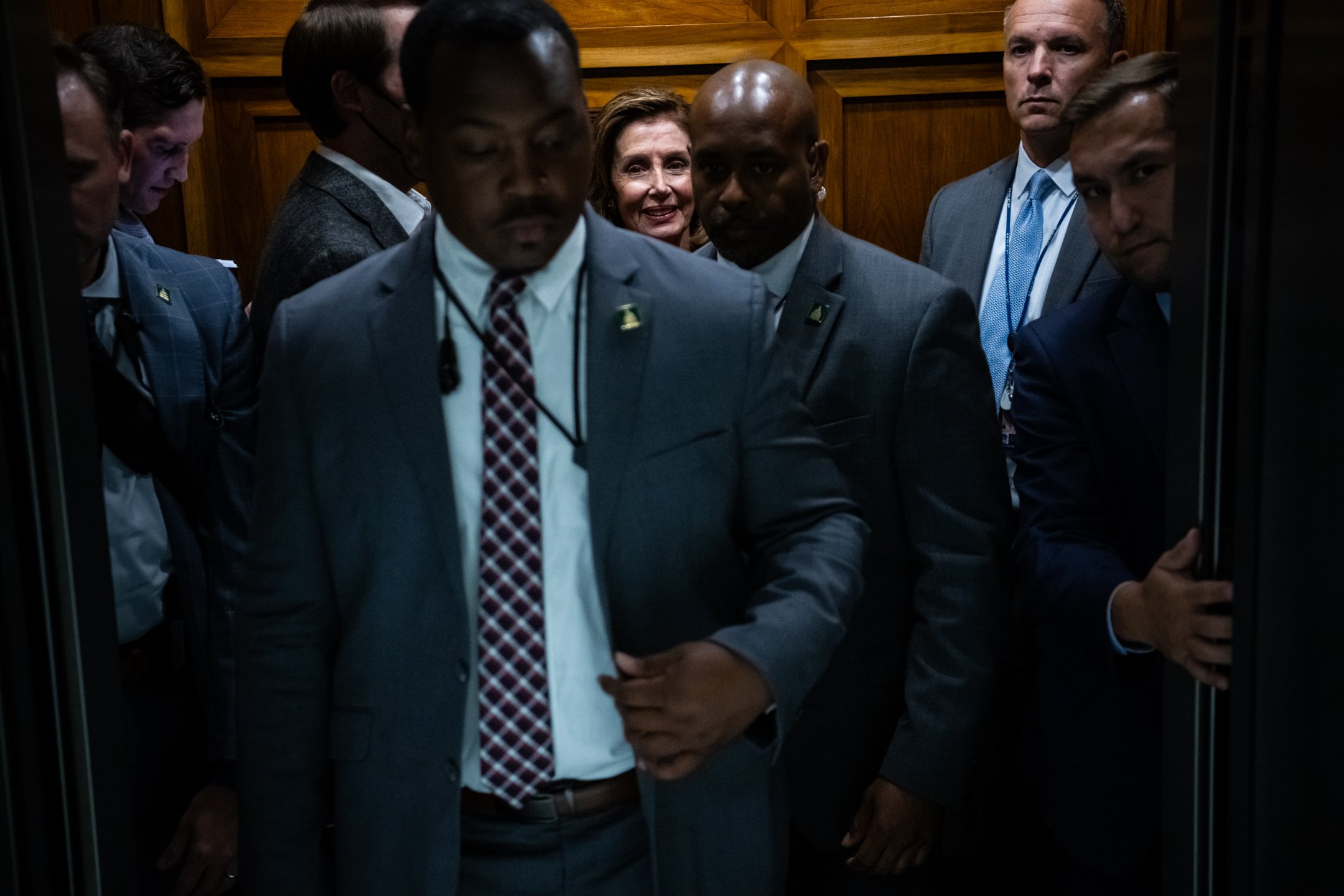  Speaker of the House Nancy Pelosi (D-CA) boards an elevator with staffers and security, at the U.S. Capitol, in Washington, D.C., on July 26, 2022. (Graeme Sloan for Sipa USA) 