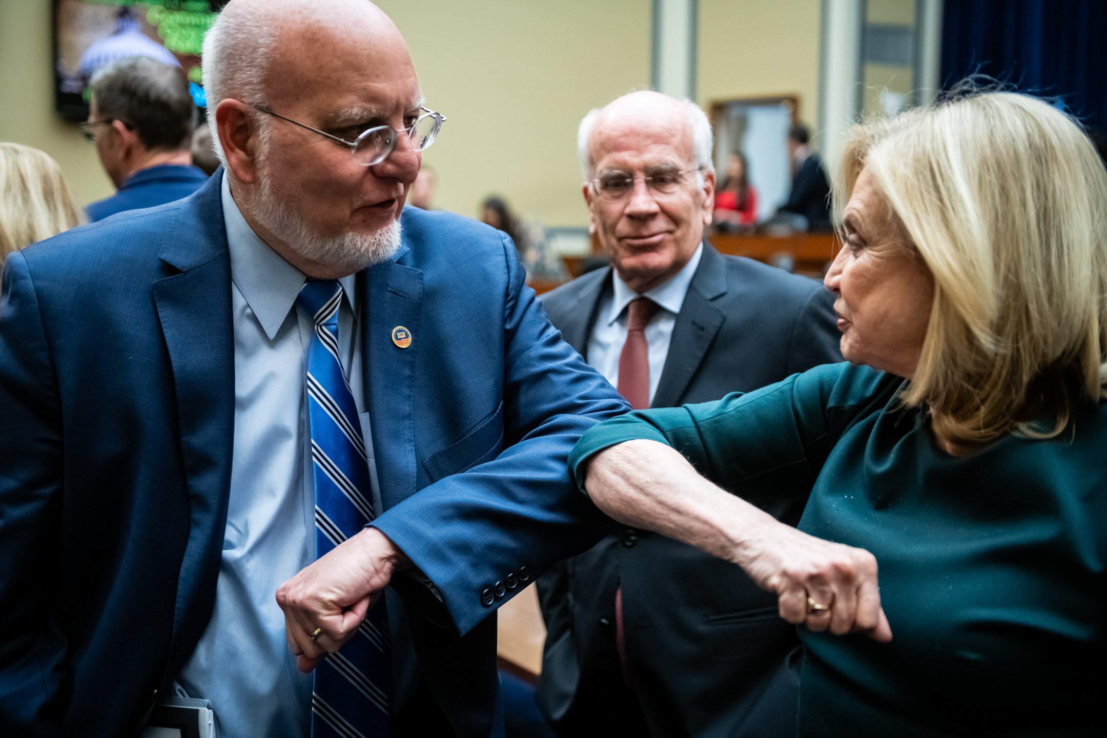  CDC Director Robert Redfield, left, elbow bumps Representative Carolyn Maloney (D-N.Y.), Committee Chair, right, after an emergency House Oversight Committee Hearing on the emerging COVID-19 outbreak, at the U.S. Capitol, in Washington, D.C., on Mar