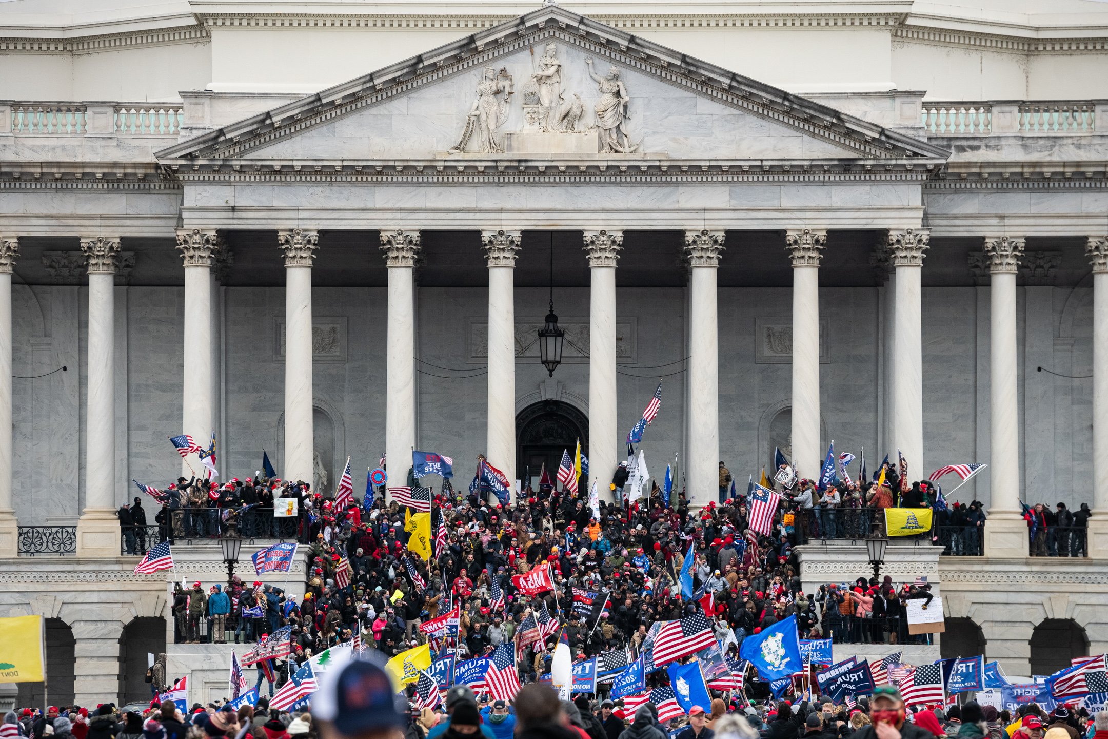  Pro-Trump rioters storm the East Front of the U.S. Capitol during the January 6 insurrection, in Washington, D.C., on January 6, 2021. (Graeme Sloan for Bloomberg) 