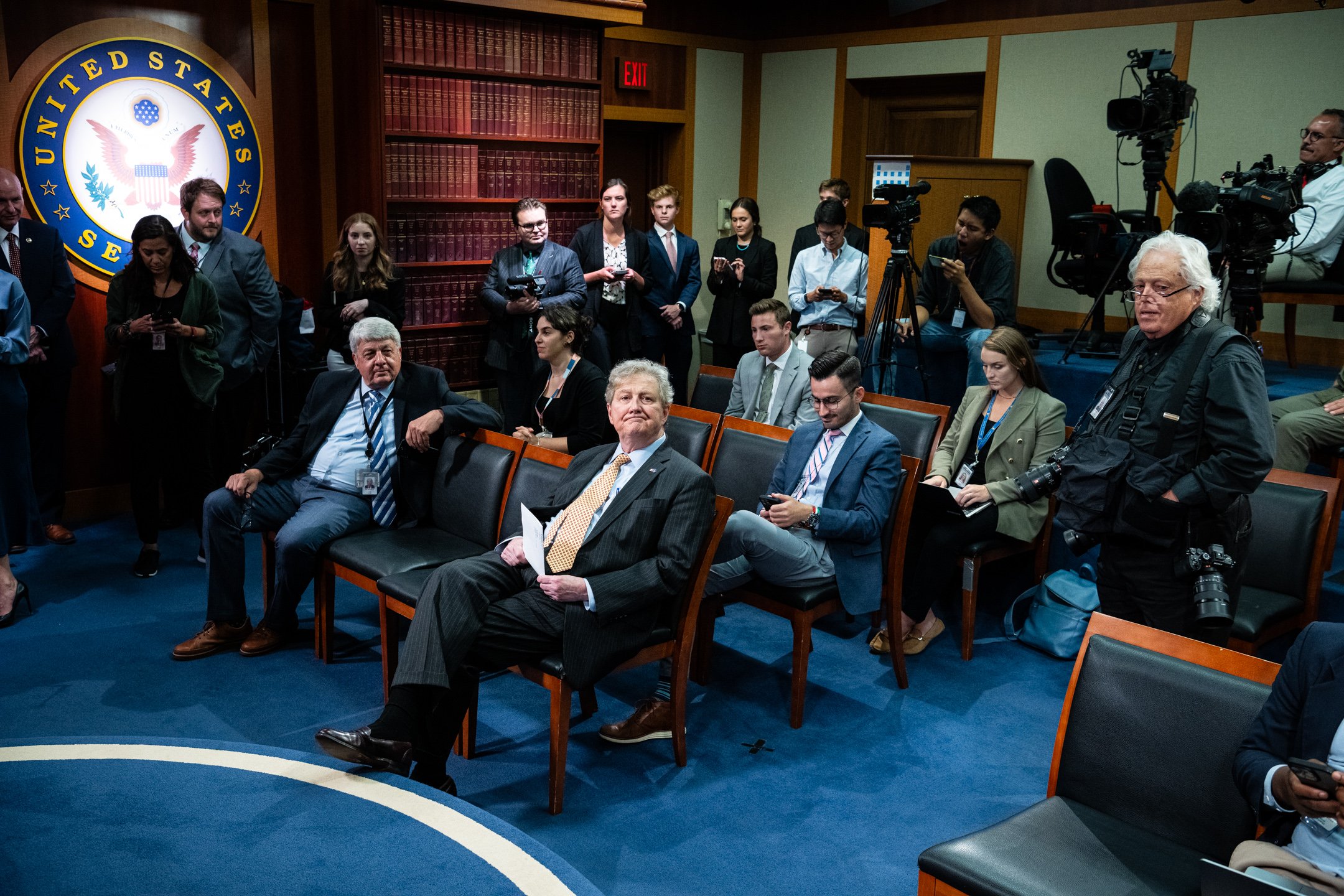  Senator John Kennedy (R-LA), center, sits among members of the media while waiting for a press conference on the Supreme Court to begin, at the U.S. Capitol, in Washington, D.C., on July 19, 2023. (Graeme Sloan for Sipa USA) 