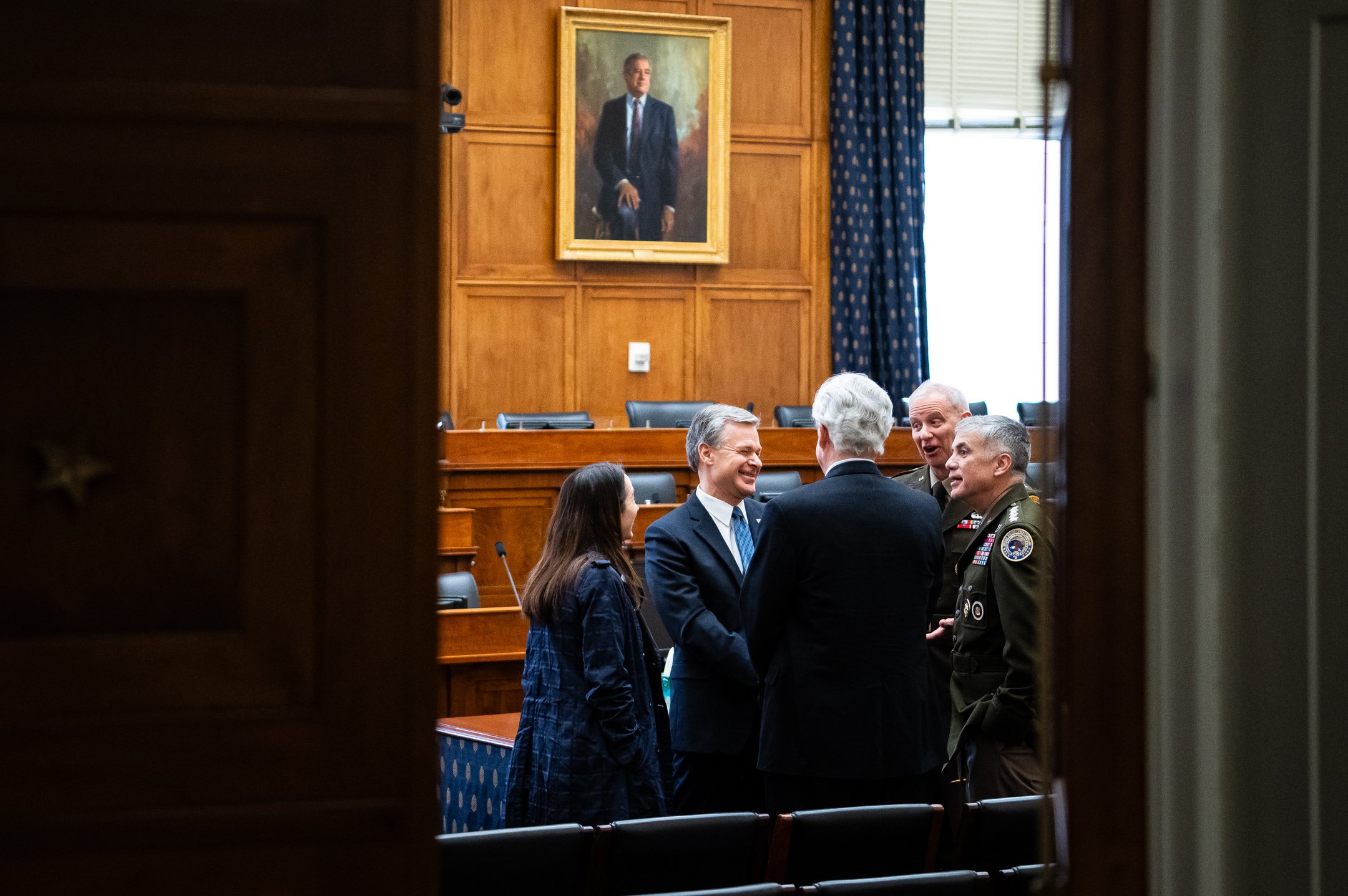  (Left to Right) Director of National Intelligence Avril Haines, FBI Director Christopher Wray, CIA Director William Burns (back turned), DIA Director Lieutenant General Scott Berrier, and NSA Director General Paul Nakasone laugh while gathering befo