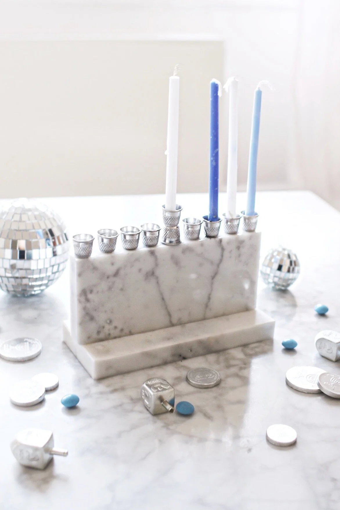 DIY Recycled Marble Menorah With Sewing Thimbles