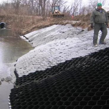 Slope sealing with cellular confinement on steep grades.