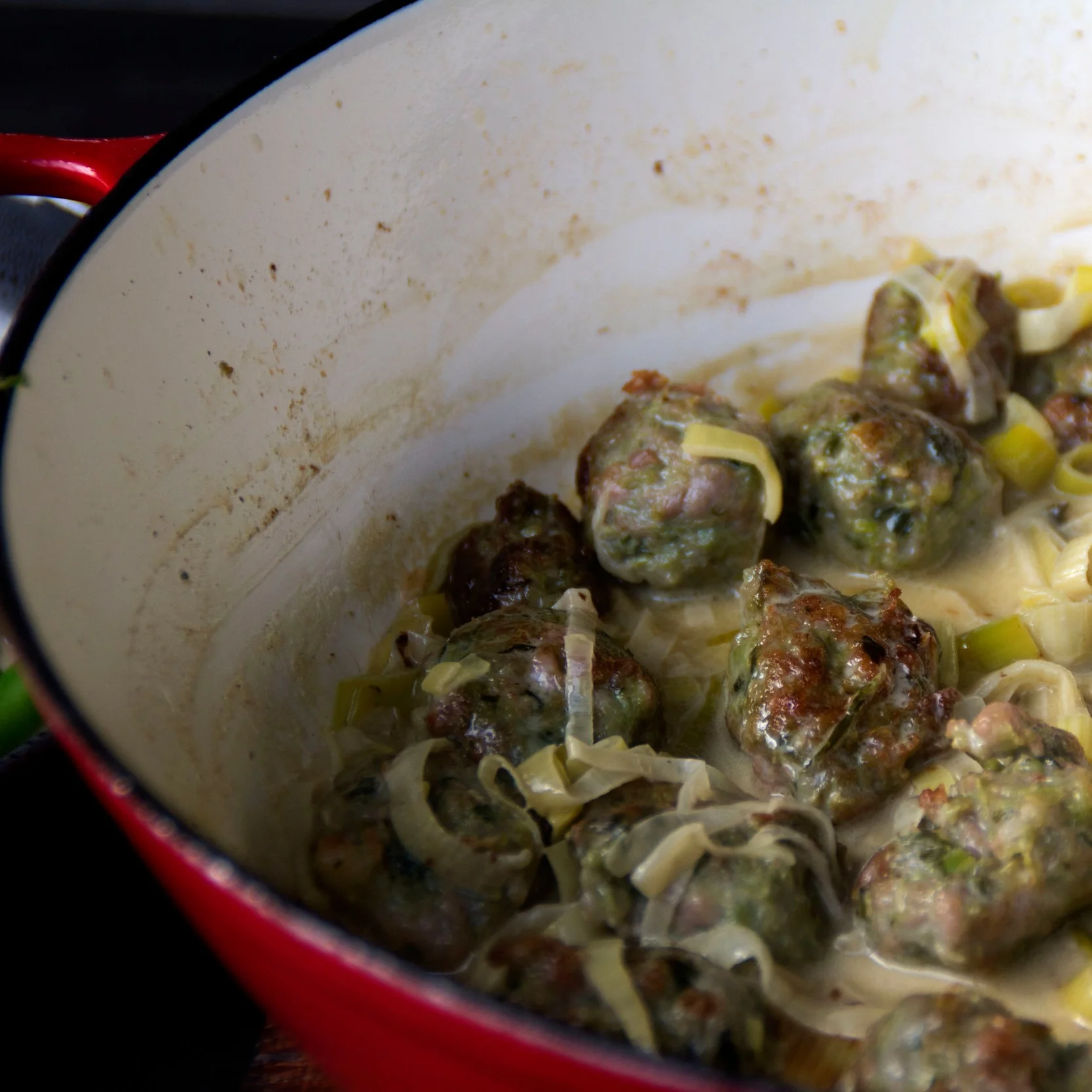 Sausages Cooked in a Creamy Blue Cheese and Leek Sauce