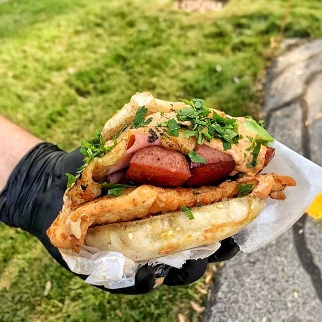 La Chilanguita - Crispy &amp; Cheesy Ham,  Milanesa de Pollo, Beef Hot Dog, Chipotle Mayo, and Avocado on a Sesame Bun. Available for Lunch today OTL 11-2pm!