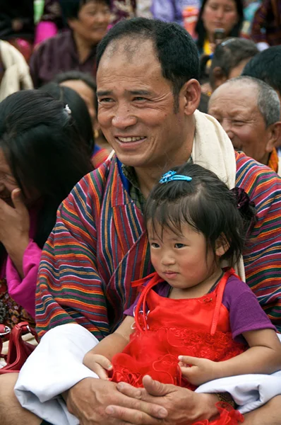 People are happy to attend the tsechus. It is a time to dress in your finest clothing, visit with friends and family, share a picnic lunch outside the dzong, and obtain religious merit through attendance.