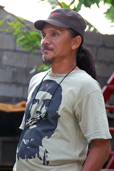 This will be the 27th crucifixion for 52-year old Ruben Enaje, popular crucifixee from San Pedro Cutud. Seen here rehearsing for the Via Crucis and his crucifixion the next day, Ruben stated, “When I am up there on the cross, I feel very close to God.”