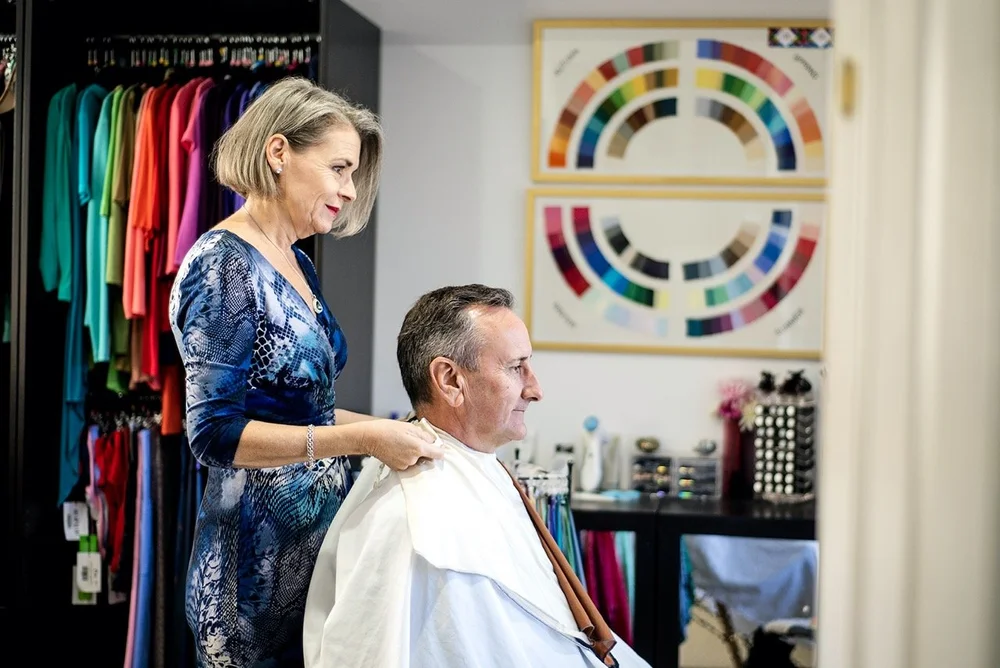 Colour analysis in Brisbane: personal stylist Ann draping a client in her colour studio
