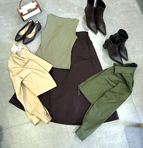 New outfit combination laid out after a wardrobe audit: blazer, top, skirt, jacket and boots