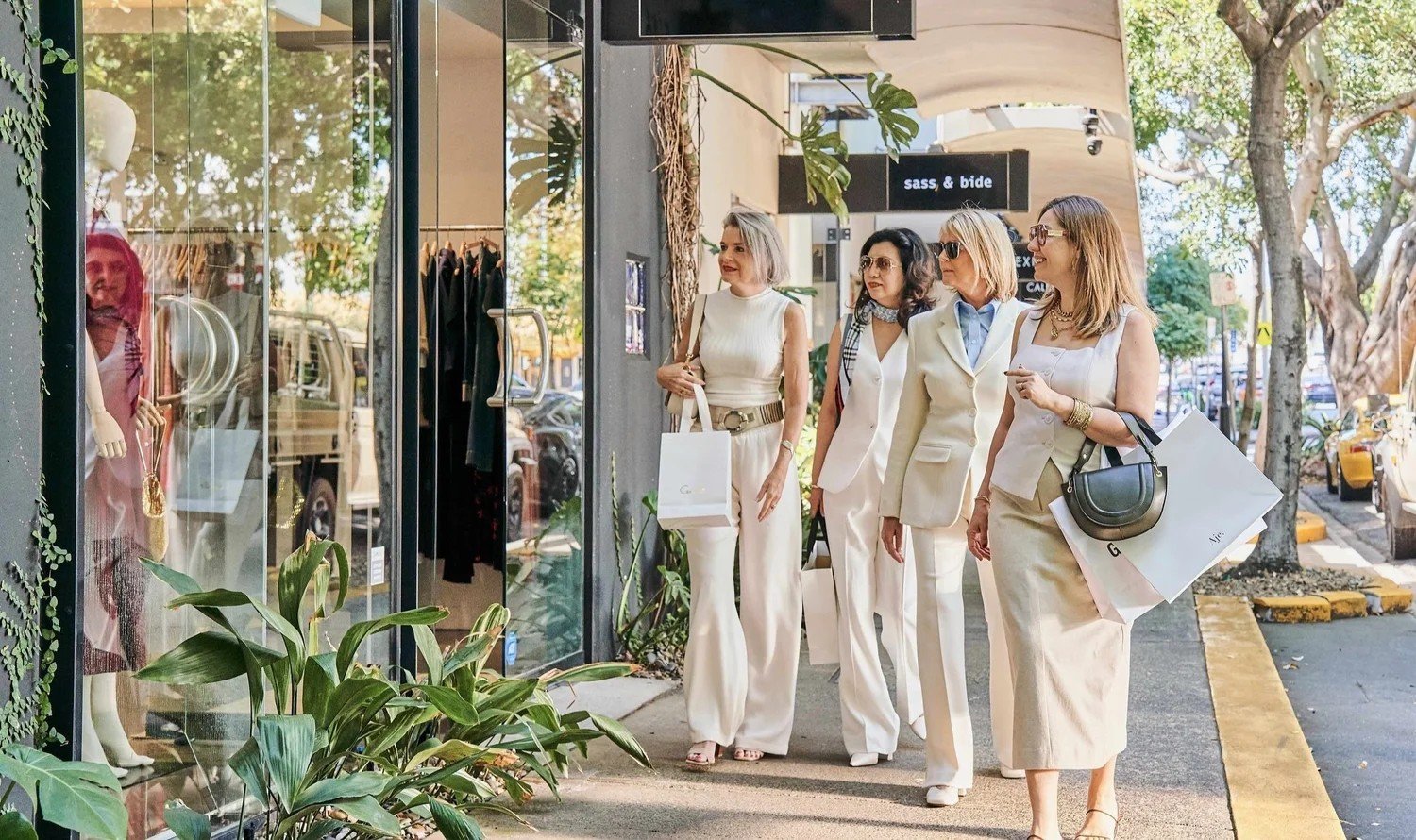 A group of friends shopping together on James Street, Brisbane, with their personal stylist