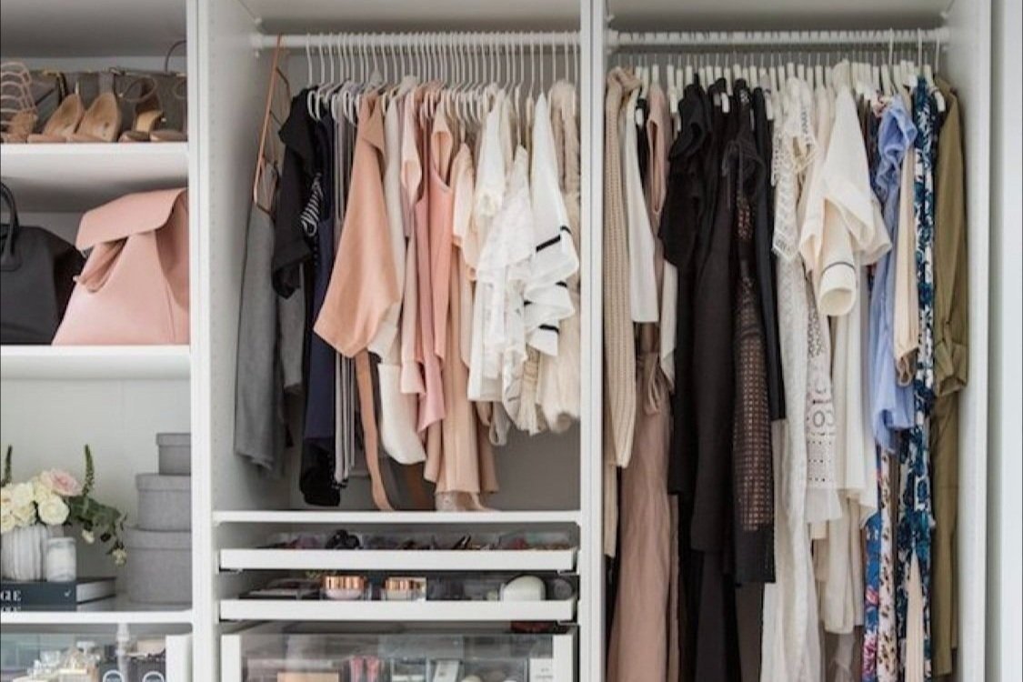 Neatly organised wardrobe after a styling session, ready for new outfits