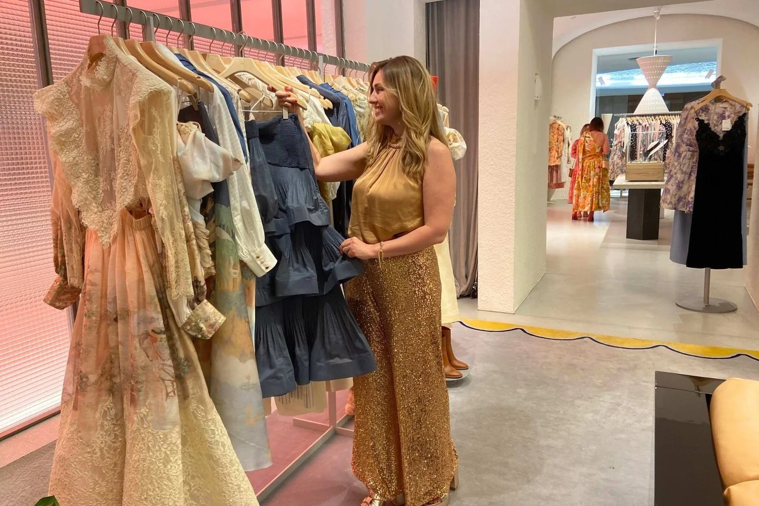 A client trying on pieces with her personal stylist in a Brisbane boutique