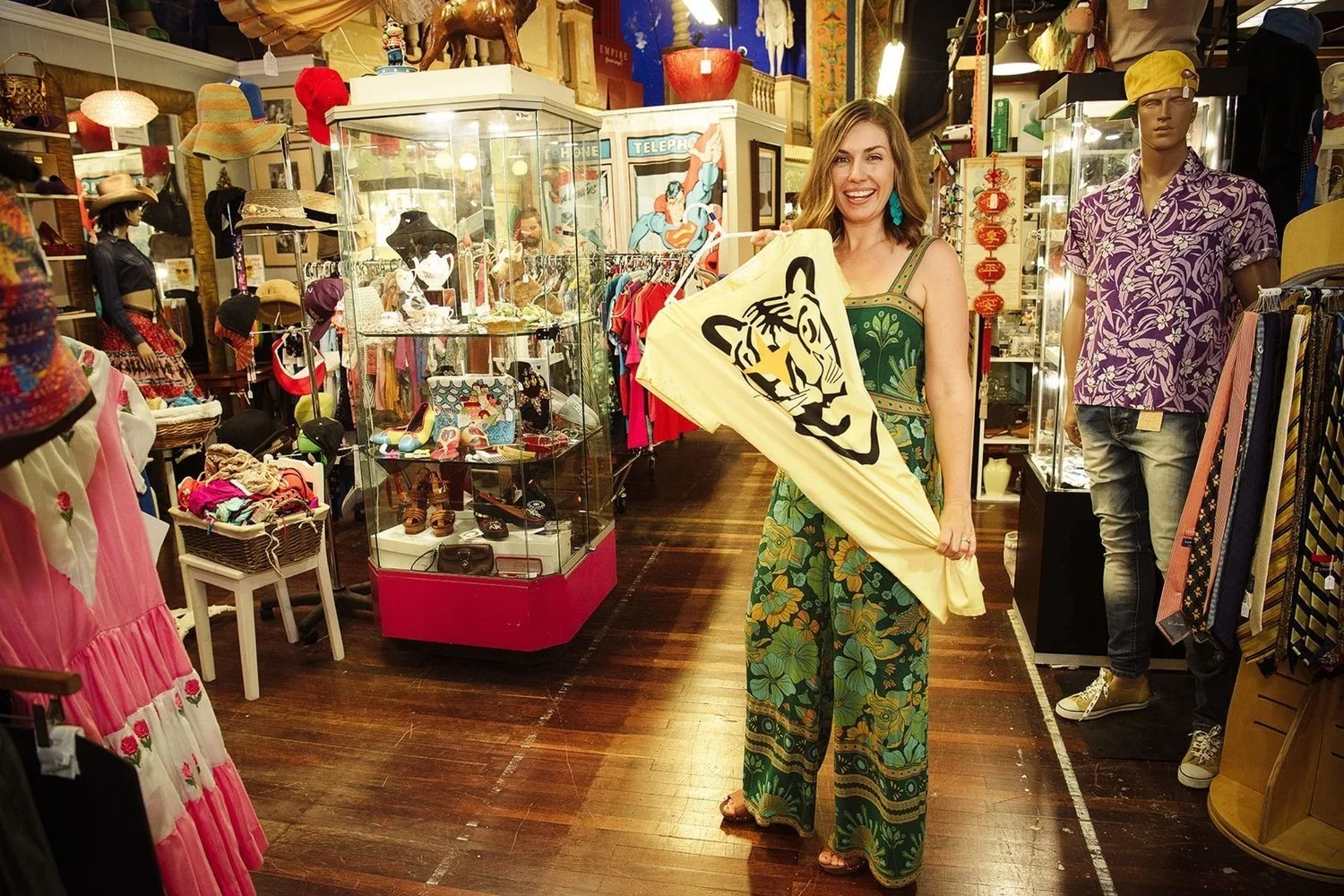 A happy client with her preloved finds in a Brisbane op shop