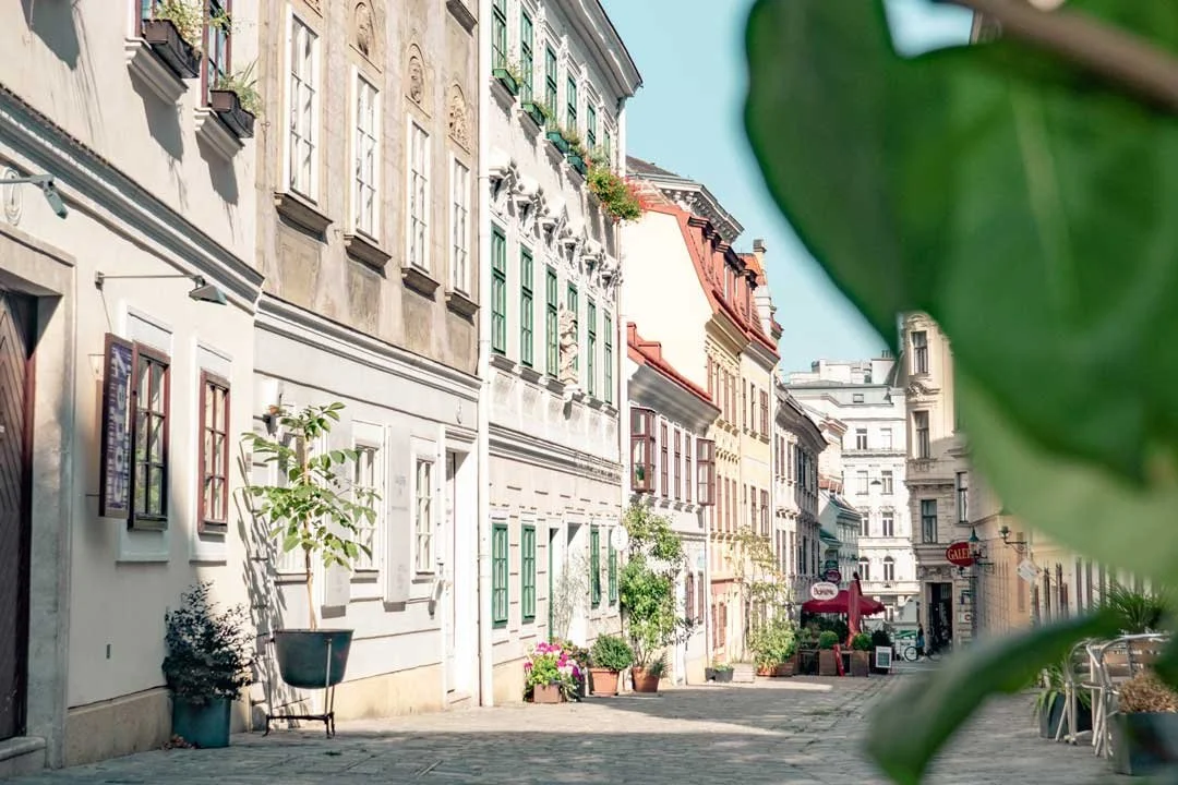 Picturesque lane in Vienna's Spittelberg — small houses, cobblestones and blue sky