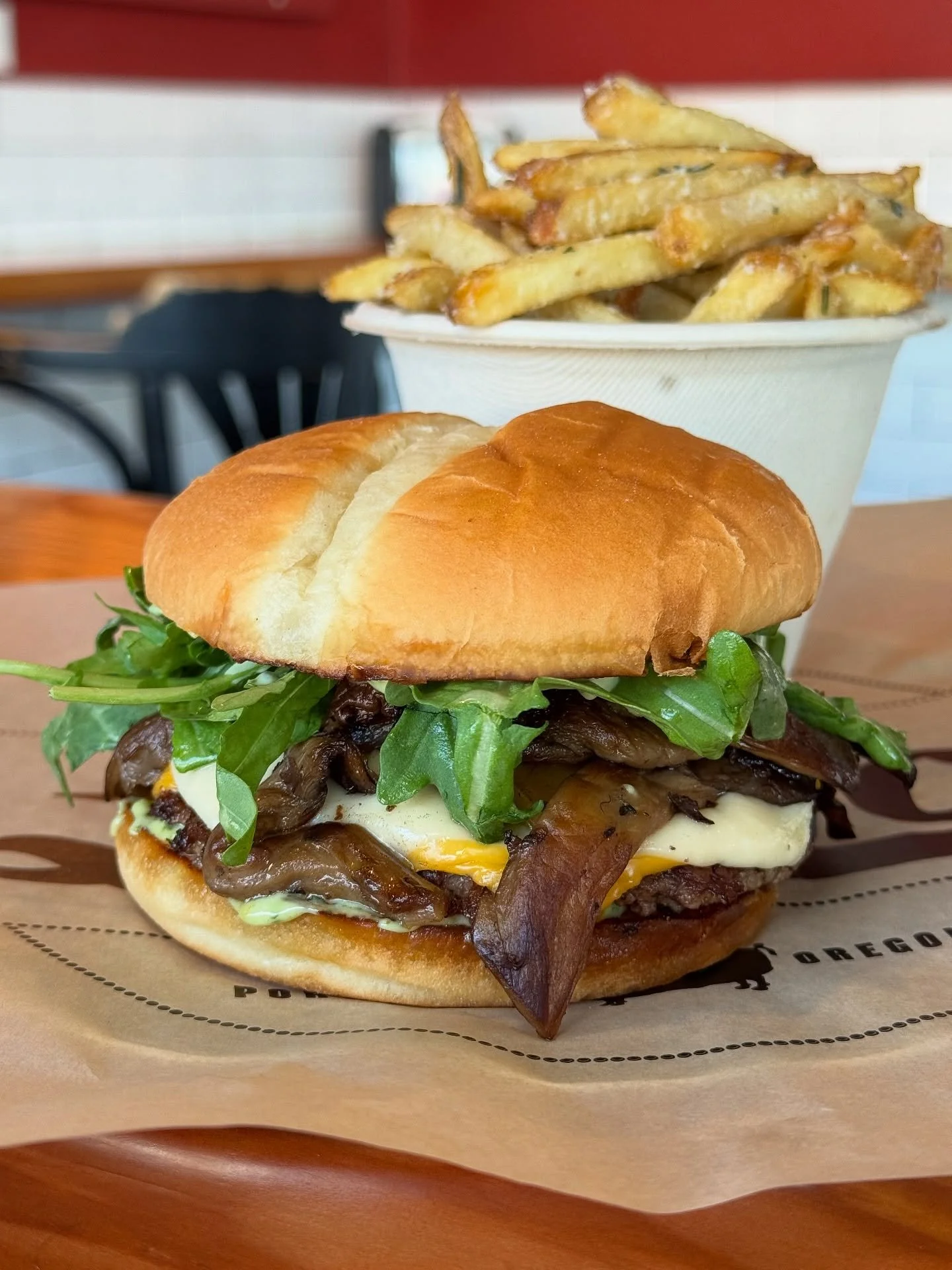The Boomer 💥 Burger is still here until next month, so don&rsquo;t forget to stop by and dig in! Topped with Oregon mushrooms, 🍄&zwj;🟫 ✨ lemony arugula, chimichurri mayo and Swiss and American cheese. 🧀  Grab a beer and call it the perfect kickst