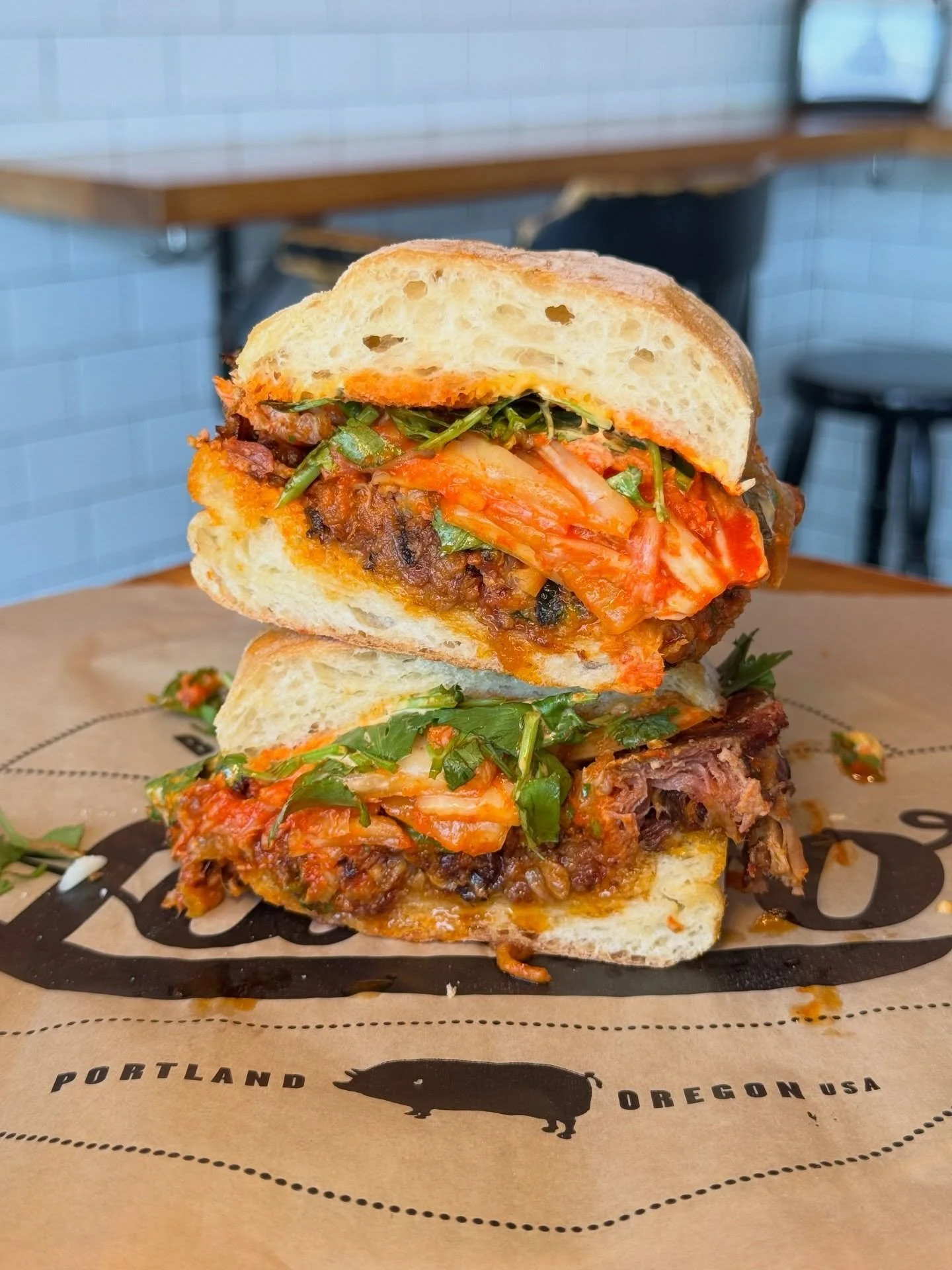 Korean Pork Shoulder Sandwich with House Kimchi! 🥬 🔥 It&rsquo;s messy, it&rsquo;s marvelous, it&rsquo;ll be here waiting for you for lunch or dinner so skip whatever plans you&rsquo;ve already made and head to @lardopdx for an OG classic! 😉 Dig in