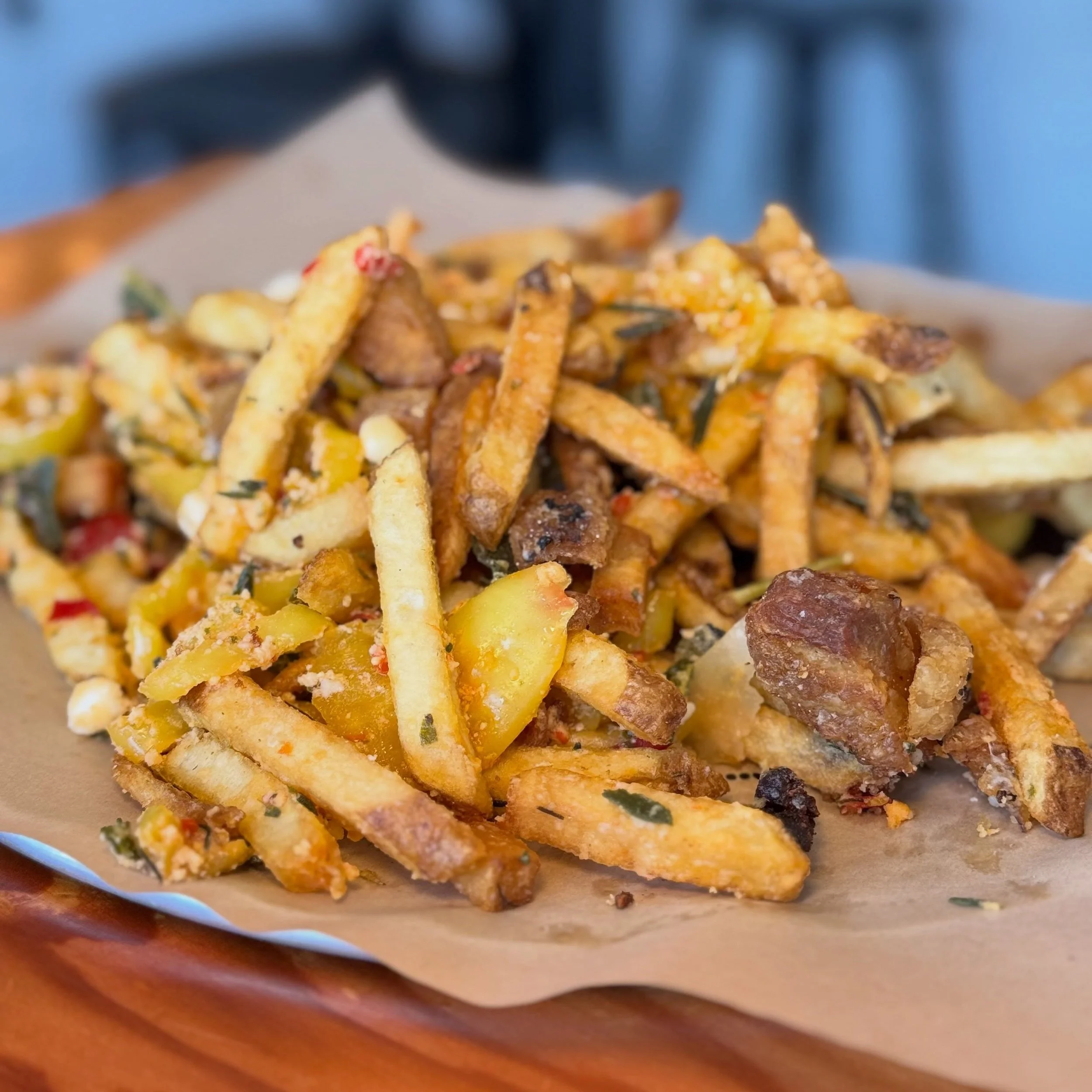Fries but make them dirty! 😉 With pork scraps, marinated peppers, fried herbs, + parmesan! 🧀 ✨ Come hungry and leave with a belly full of delicious spuds! 🥔 We also have a new burger on the menu, so don&rsquo;t miss it! 🍔 
&bull;
&bull;
&bull;
be