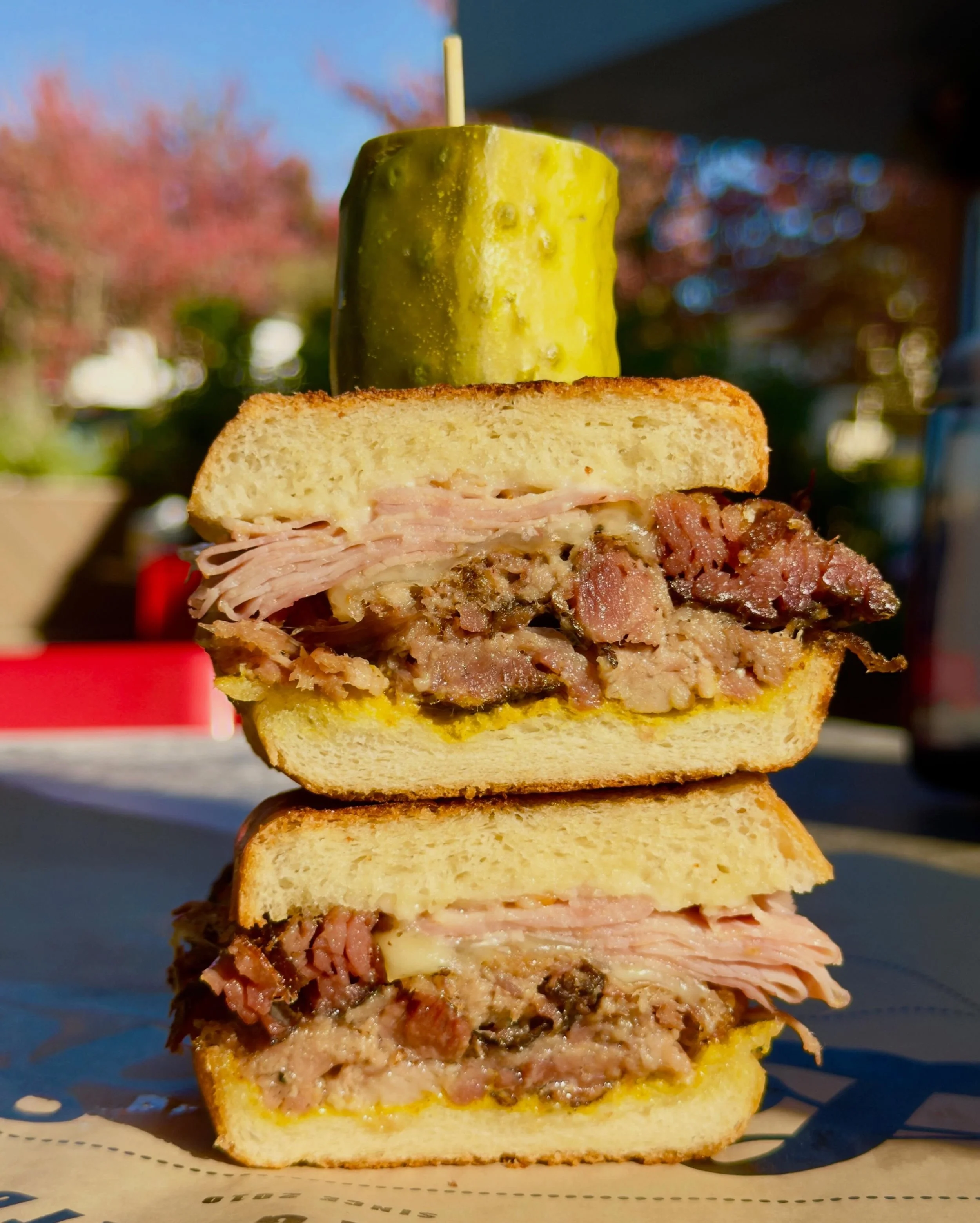 Our Smokey Cubano is a STAPLE here at Lardo.

With smoked mojo pork shoulder, shaved ham, swiss cheese, sweet pickles, yellow mustard, and mayo! #yum