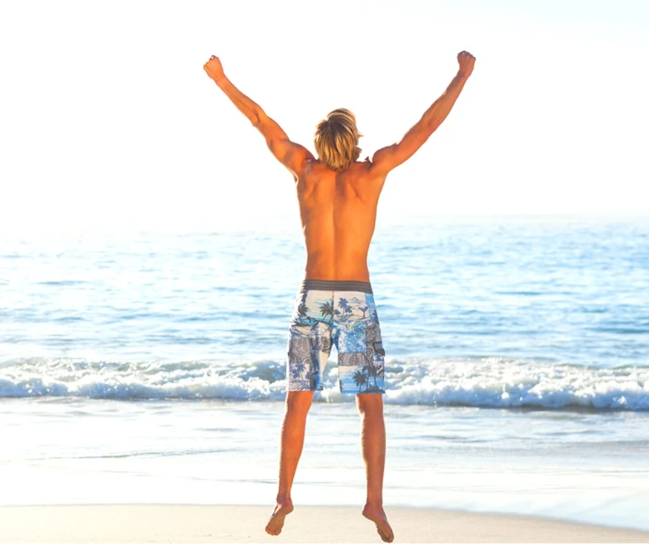 Man working out on beach.