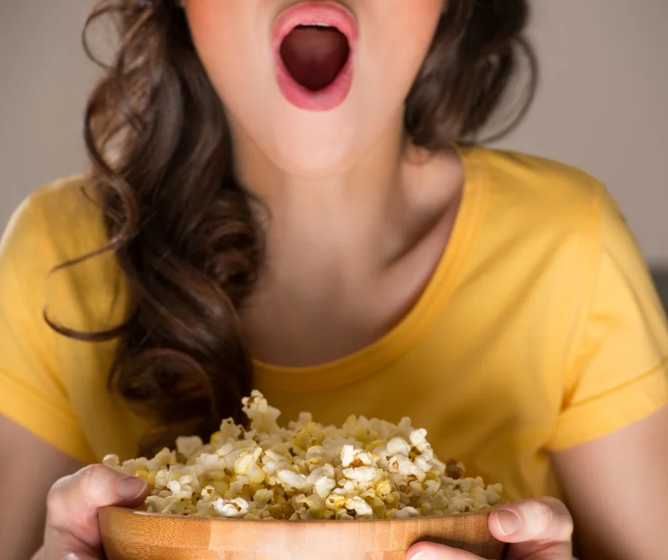 Woman splurging on popcorn.