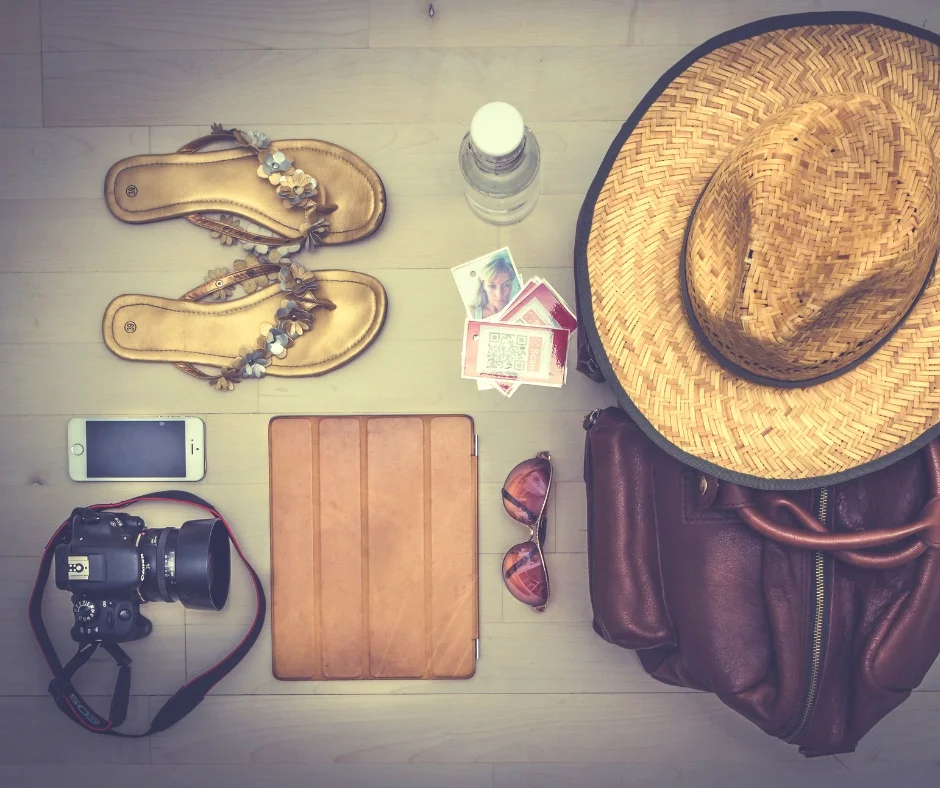 Items to pack for your fitness vacation like flip flops, hat, sun glasses and more.