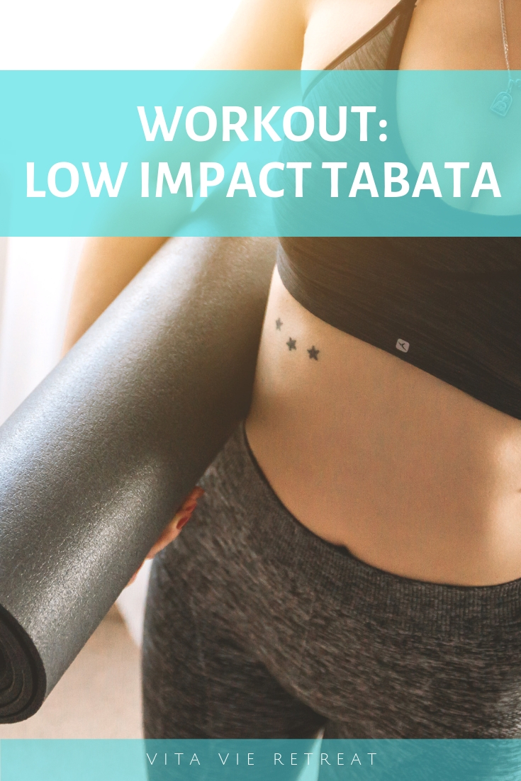 Woman with a mat getting ready for low impact tabata.
