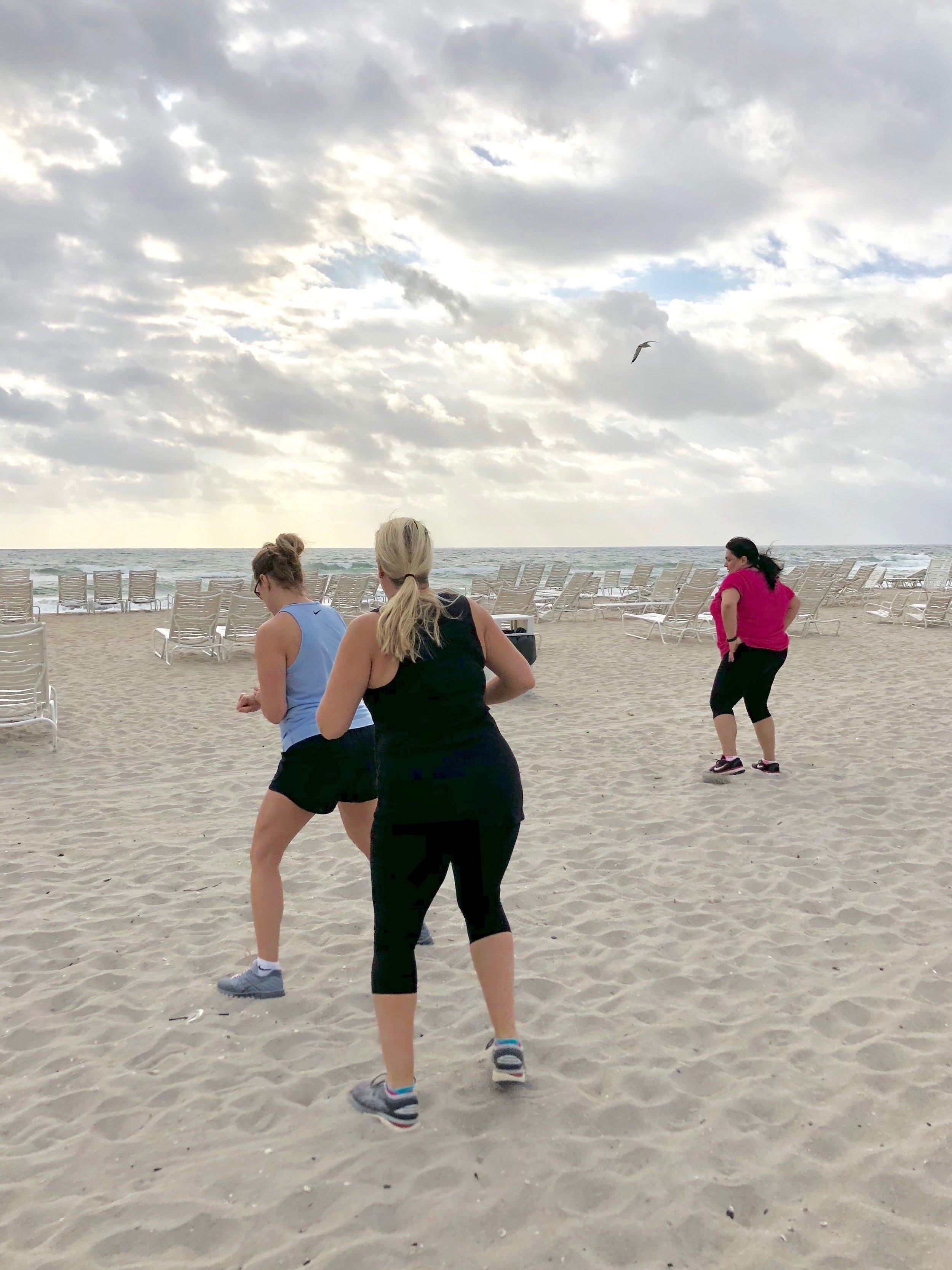 Guests enjoy another workout on the beach.