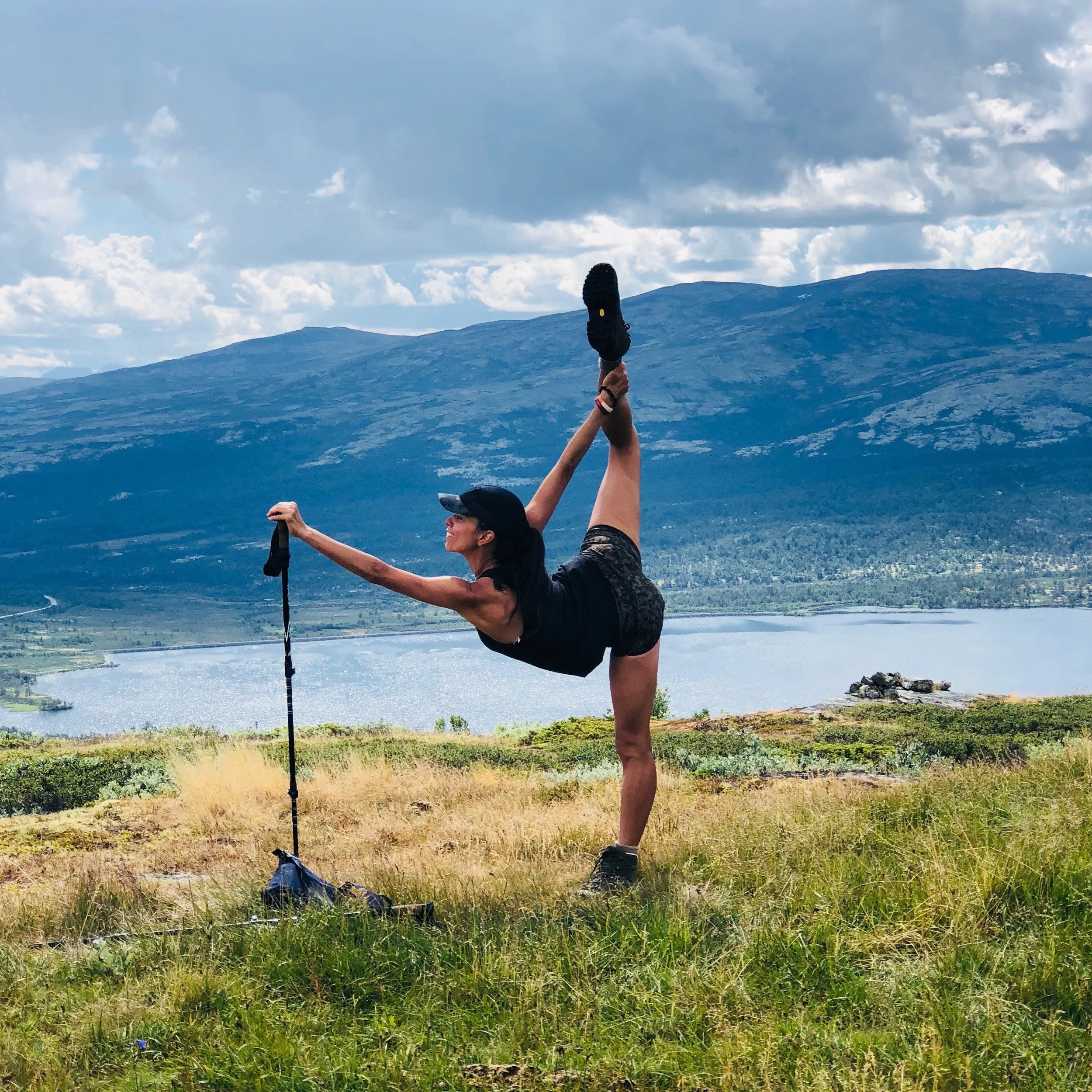 CHRISTINE THOMAS, A PILATES AND DANCE TEACHER, SHOWING HER STRENGTH IN A BALANCE POSE.