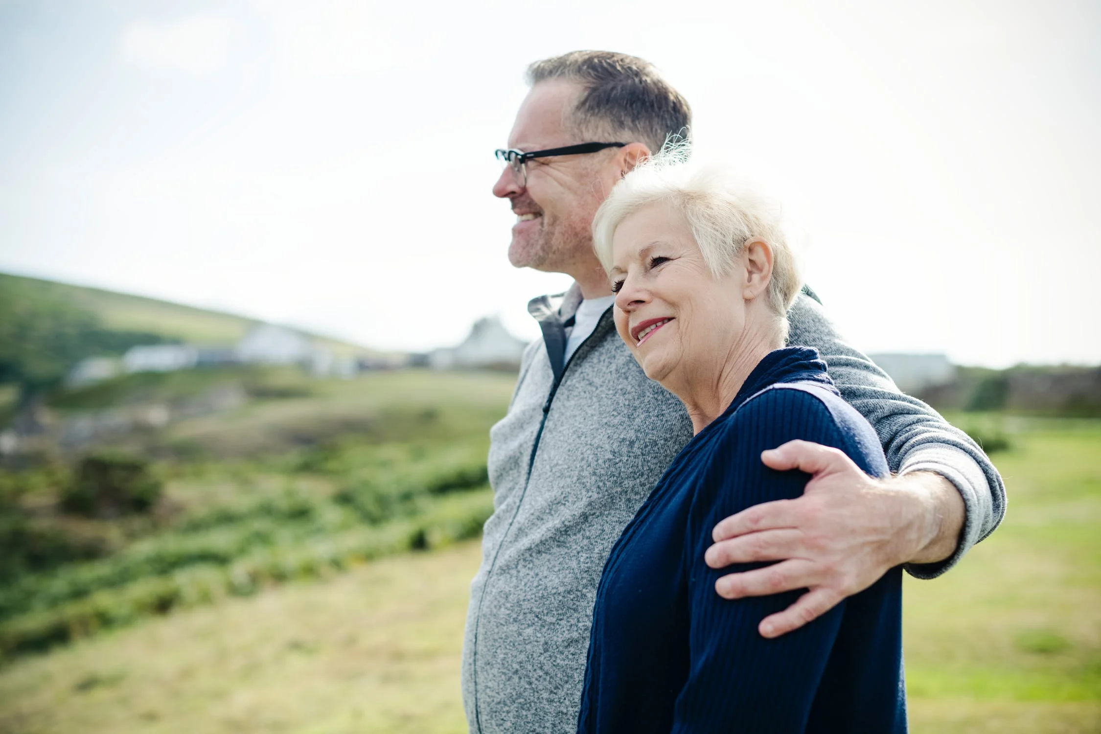 Active older couple take a walk.