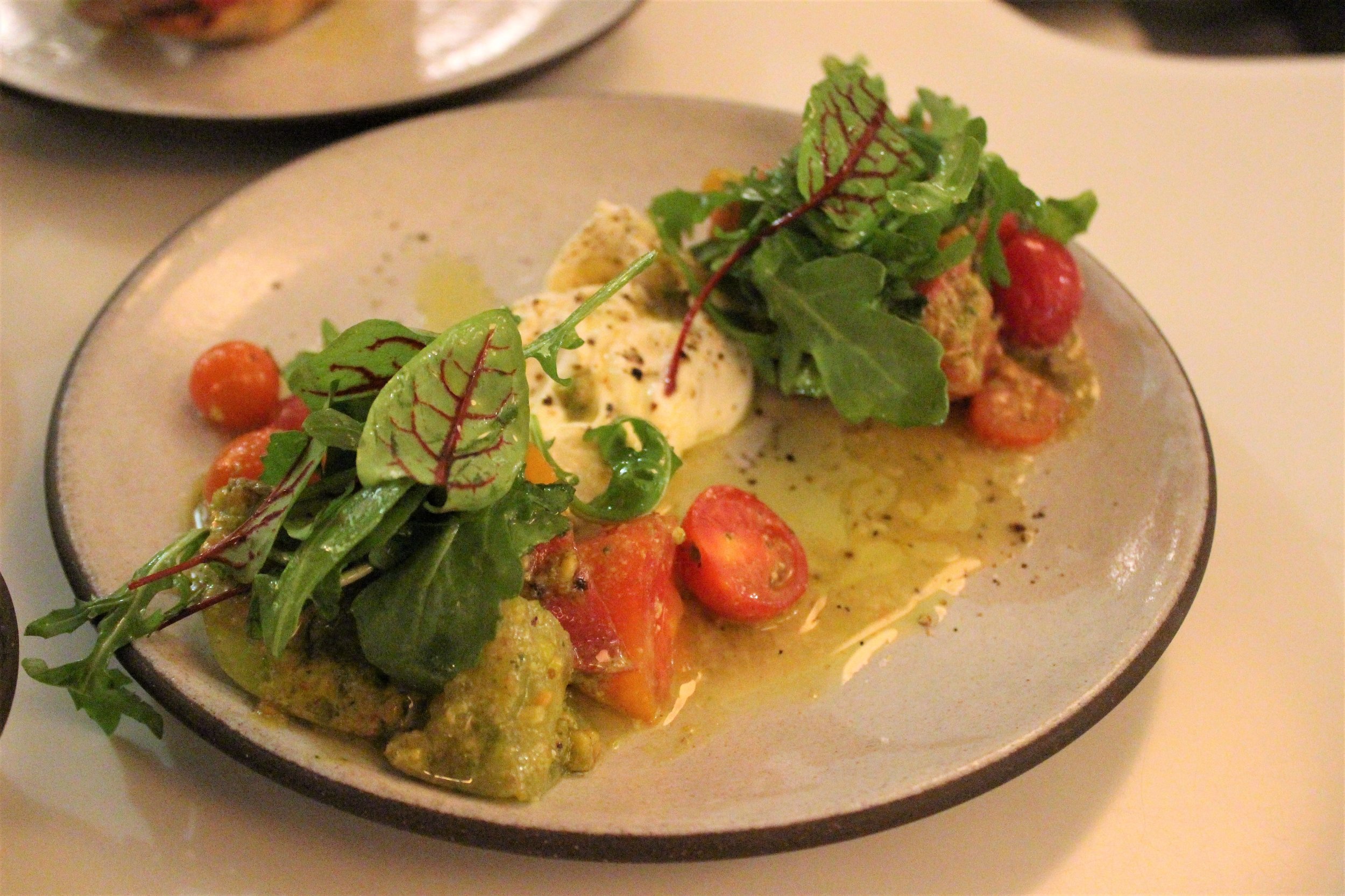 Heirloom Tomato Salad with Burrata, Pistachio Pesto, Arugula at Sportello in Boston