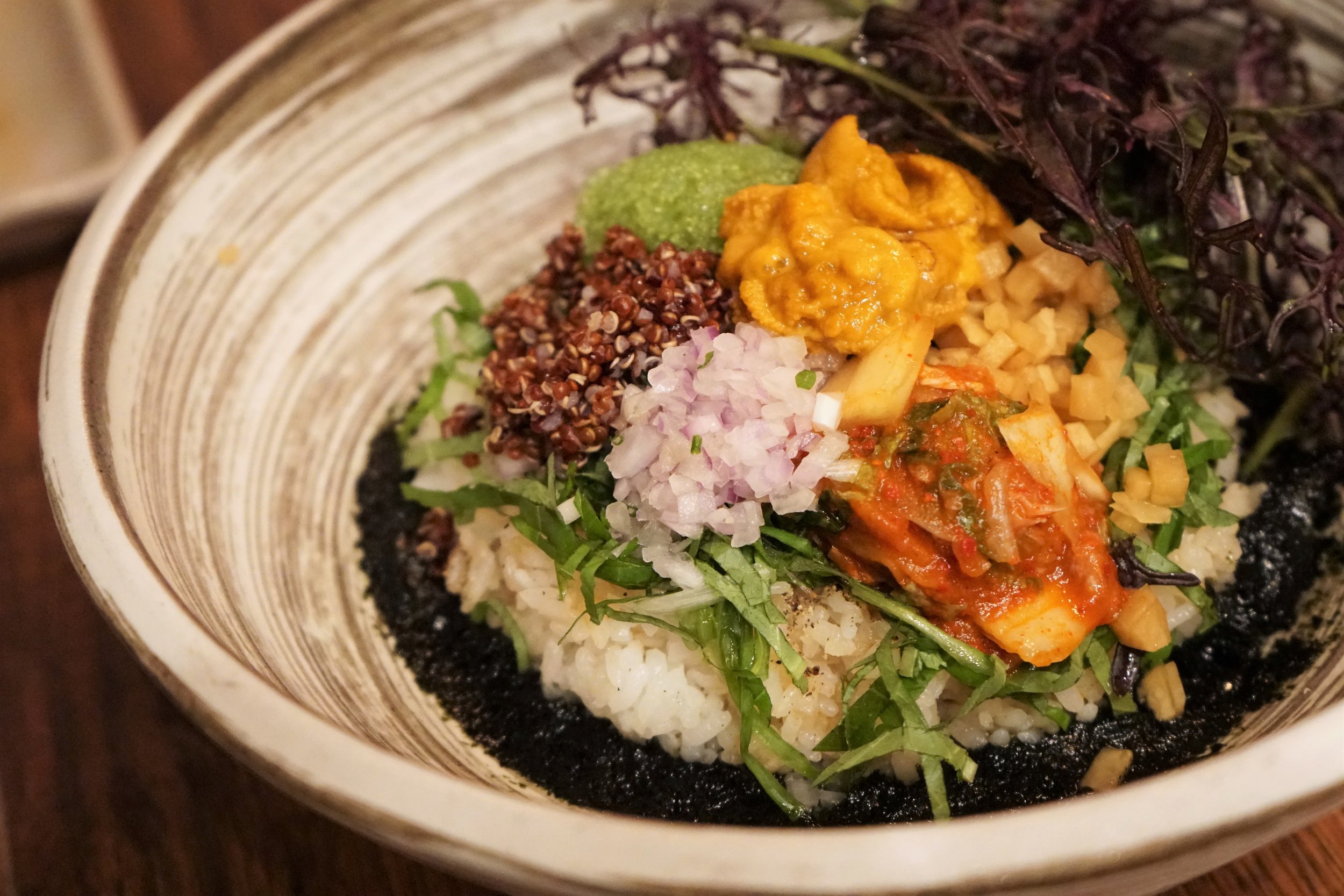 Uni Bibimbap with Quinoa, Rice, Kimchi, Soy Pickle, Perilla, Seaweed Puree, Baby Greens at Osamil in New York City