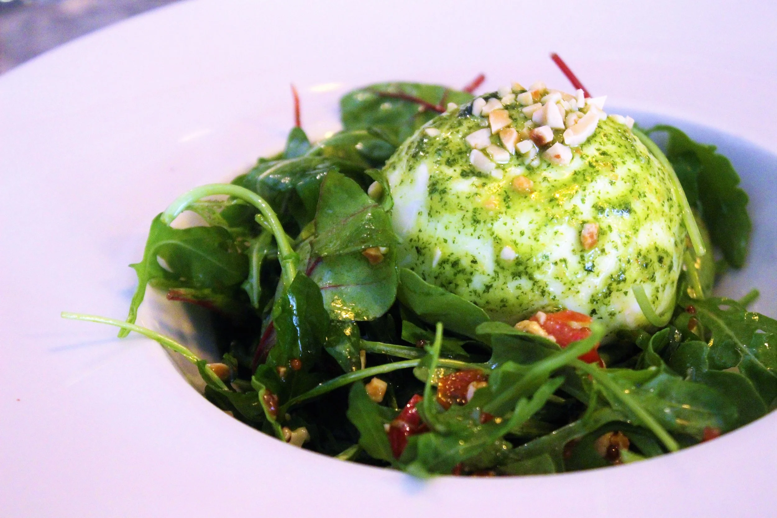 Buffalo Burrata, Arugula, Sun-Dried Tomatoes, Nuts, and Basil Pesto at Cera 23 in Barcelona
