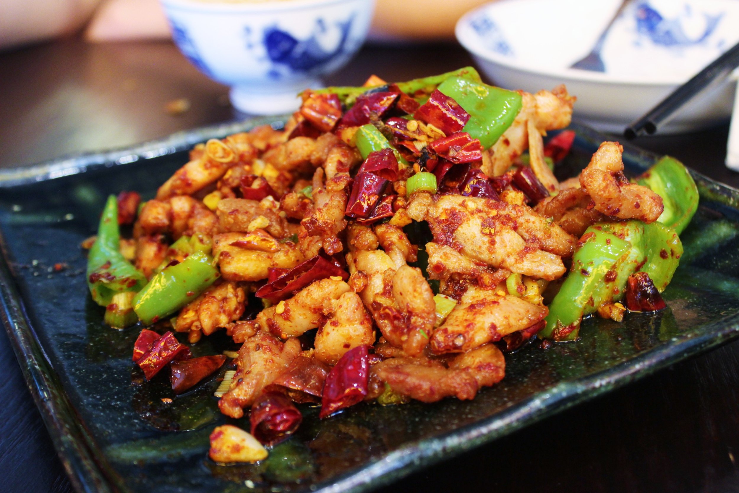 Three Pepper Chicken: Stir-friend with red and green chili peppers and peppercorn