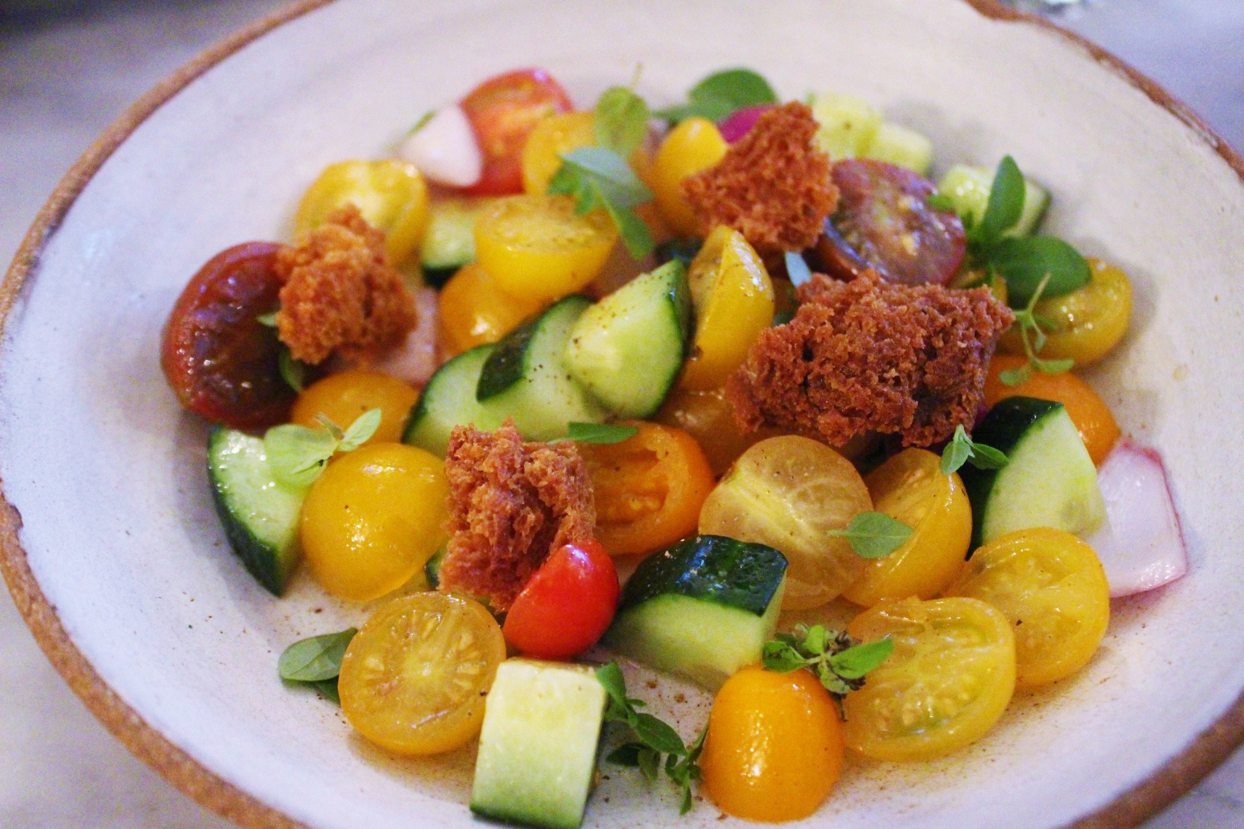Salad of Cherry Tomatoes, Cucumbers, Fried Sourdough, and Red Onion