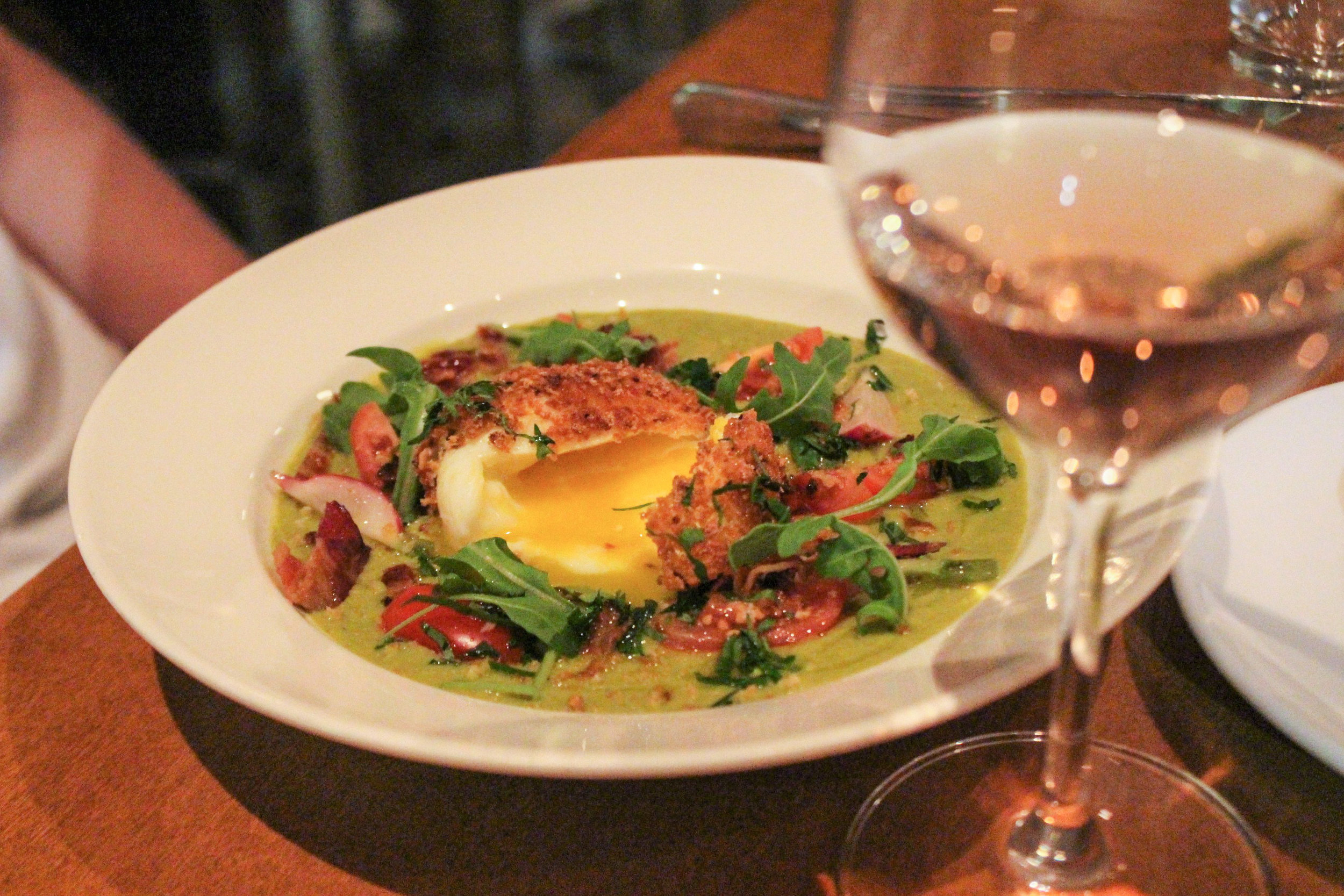 Creamy Asparagus Velouté, Soft Breaded Fried Egg, Herbs, and Bacon