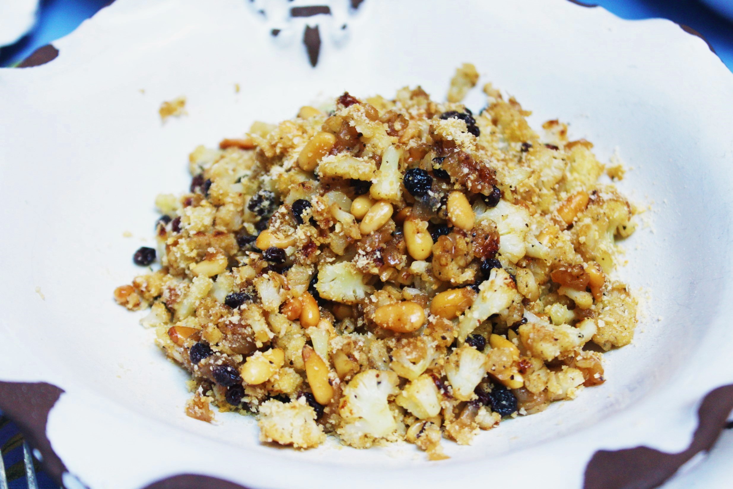 Cavolfiore Palma Sautéed Cauliflower With Pine Nuts, Currants, Caramelized Onion And Breadcrumbs