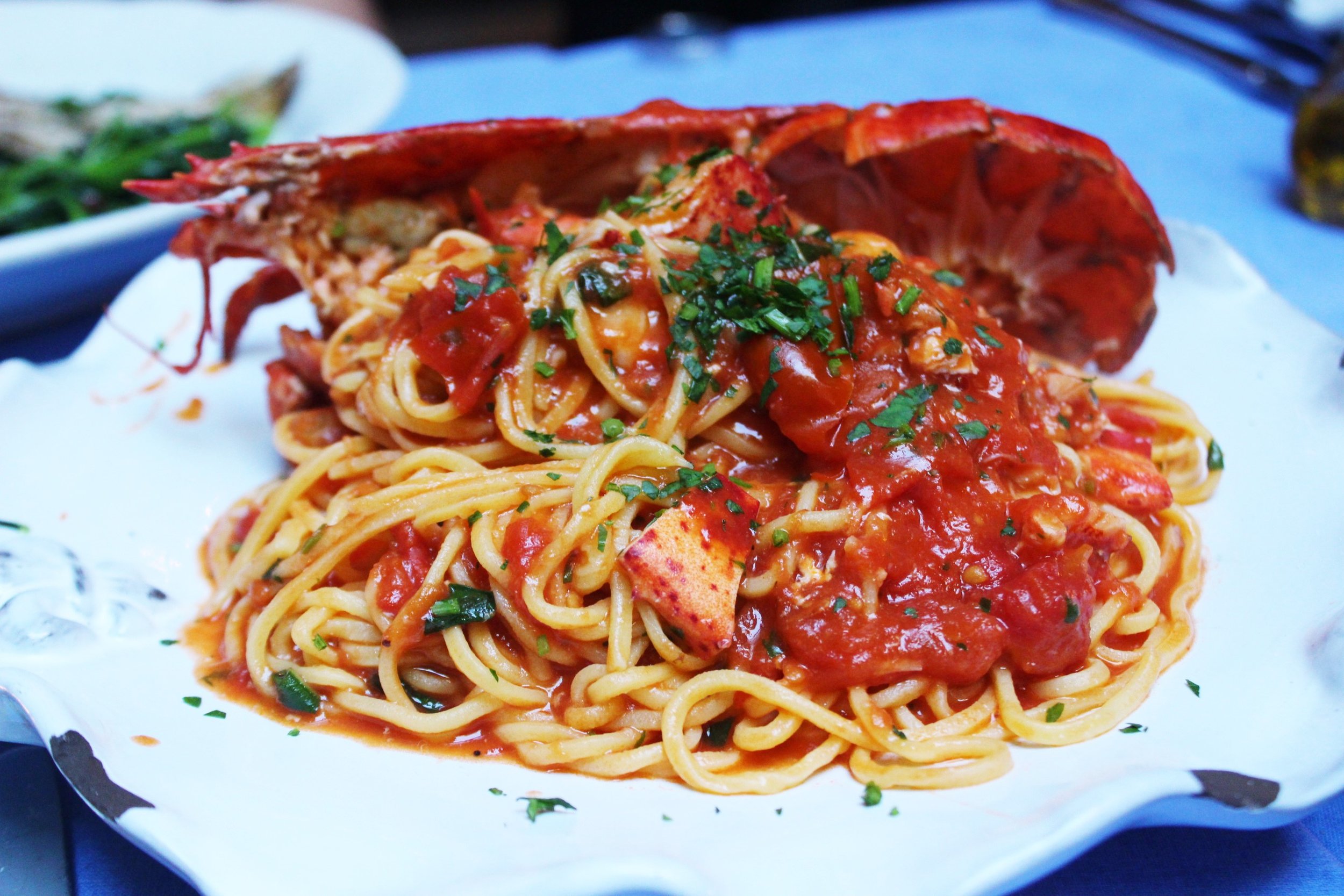 Spaghetti All’astice Half Maine Lobster With Homemade Spaghetti In A Sauce Of Lobster, Cherry Tomato And Brandy