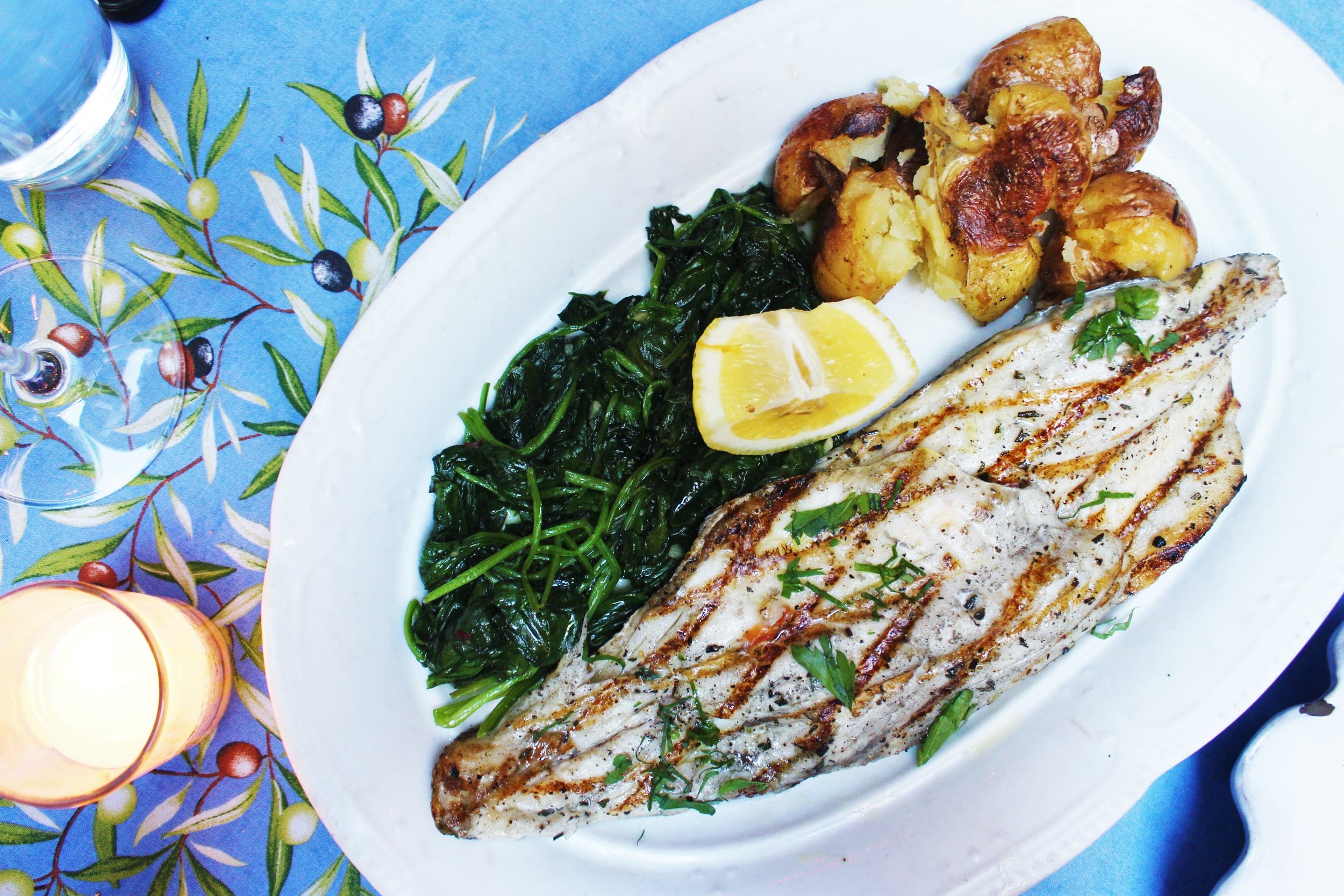 Branzino Alla Griglia Grilled Italian Sea Bass With Sautéed Spinach And Herb-Pressed Potatoes