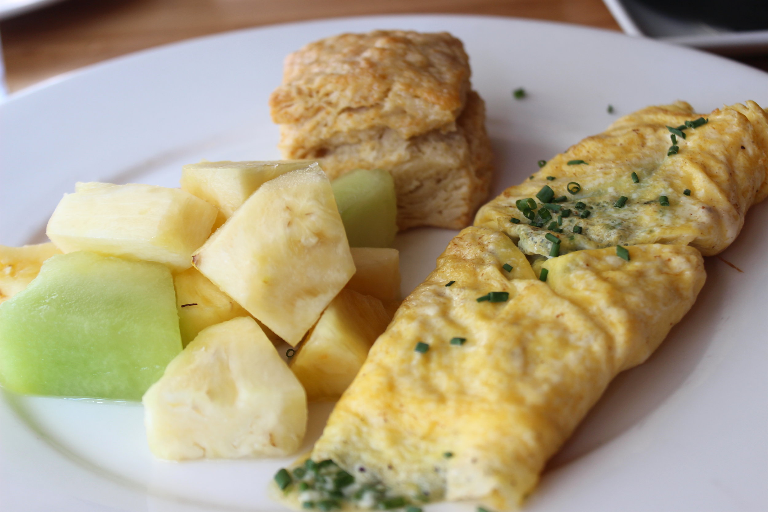 Omelet with Farm Fresh Eggs, Seasonal Fruit, House-made Buttermilk Biscuit