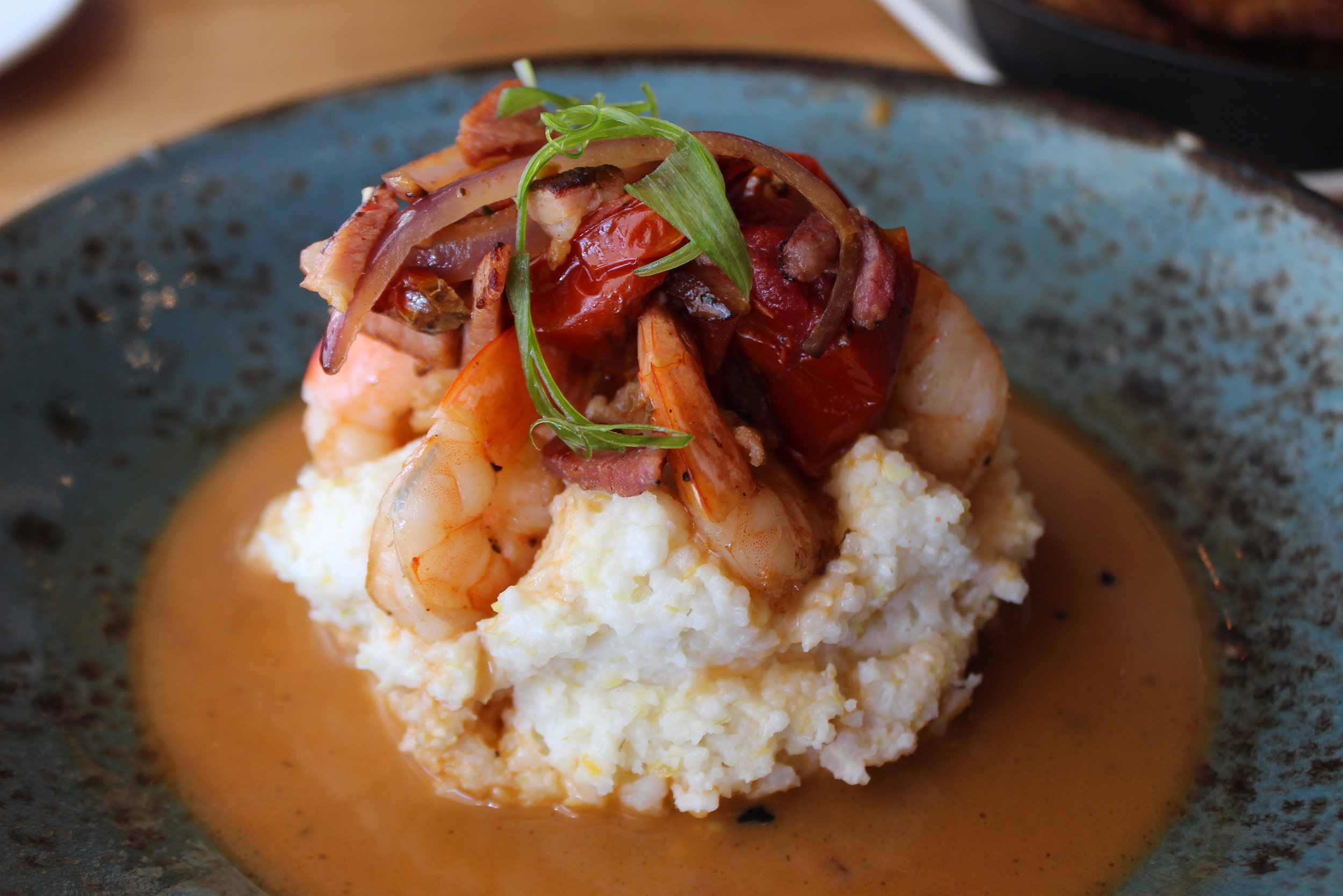 Shrimp n’ Grits: Seared Shrimp, Roasted Tomatoes, Virginia Ham, Nora Mill Grits, PBR Chicken Jus