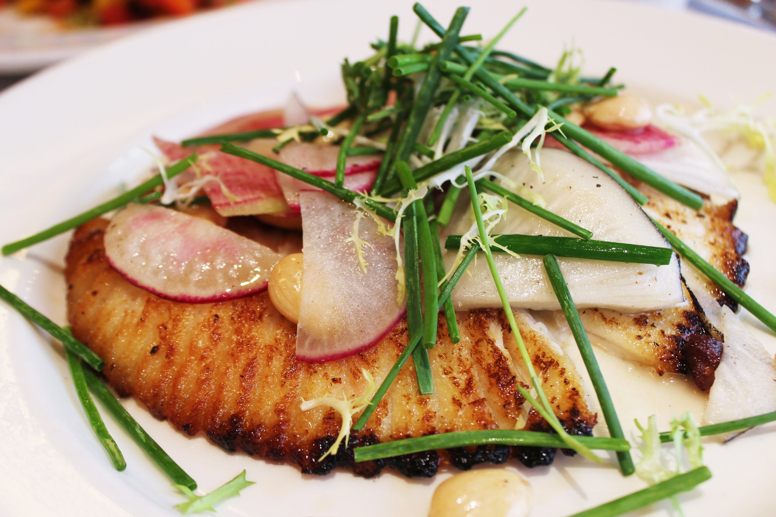 Sautéed Skate with summer beans, radish, marcona almonds and spring onion soubise