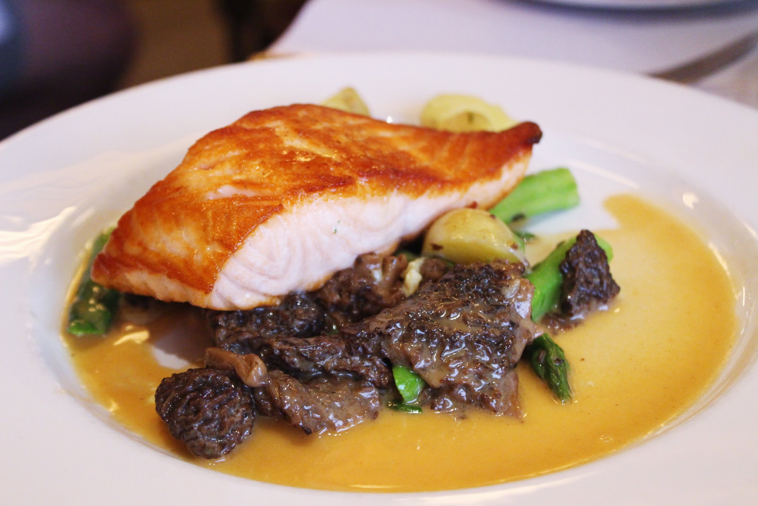 Pan Roasted Organic Salmon with asparagus, chanterelles, new potatoes and lobster beurre blanc 