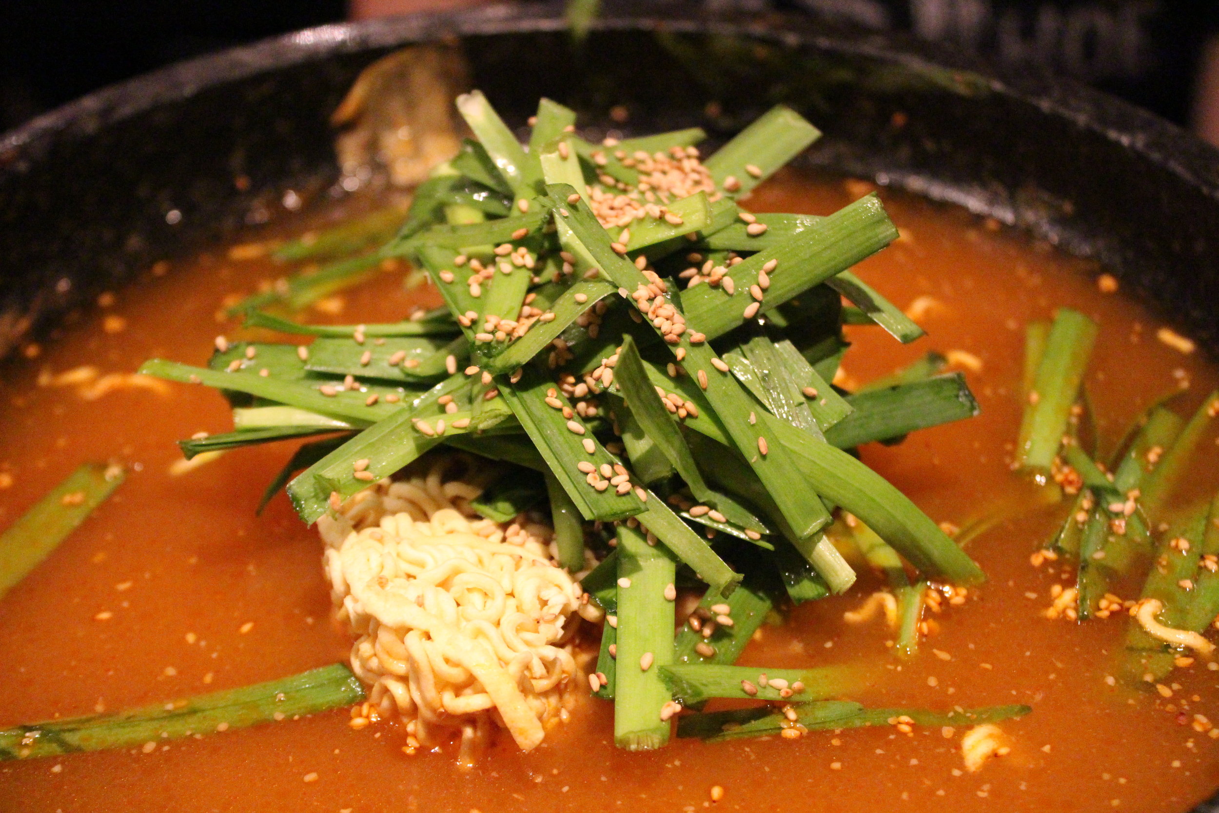 Hakata Tonton Hot Pot a specialty of hakata, japan, collagen broth, tofu, dumplings, vegetables, berkshire pork belly and tonsoku