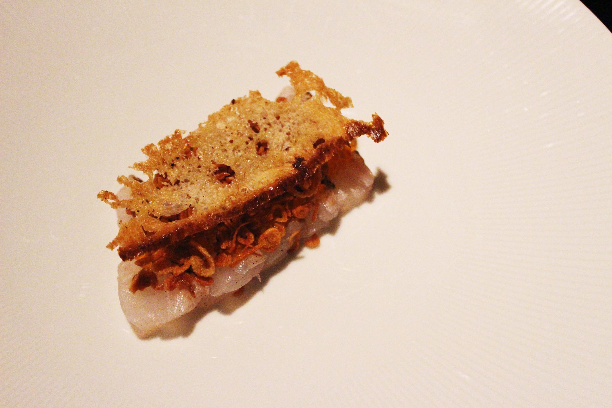 Crudo di Dentice: red snapper crudo, garlic créma, crispy shallots, trout roe 