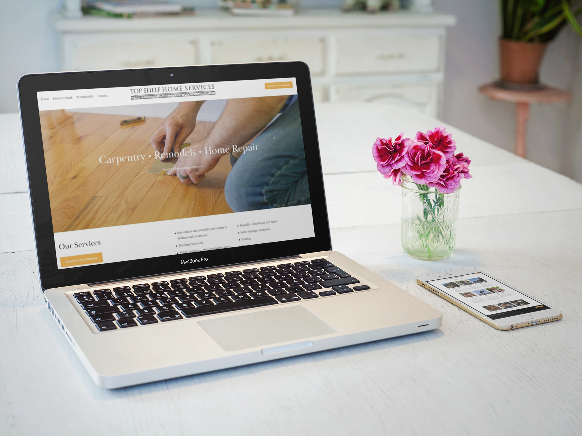 mockup-of-an-iphone-6-lying-next-to-a-macbook-pro-on-a-wooden-table-a5532b.png