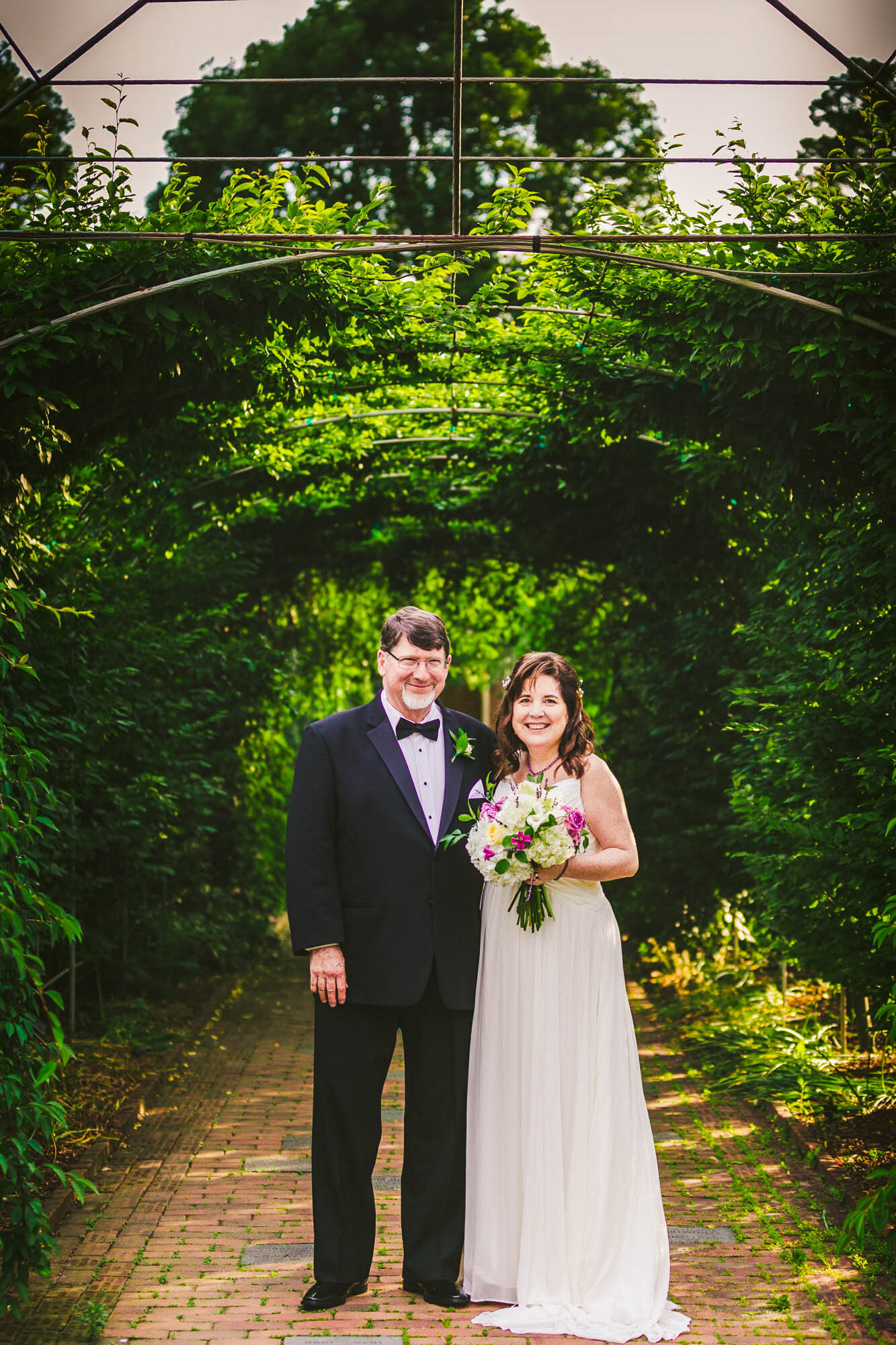 bride and groom in arbor.jpg