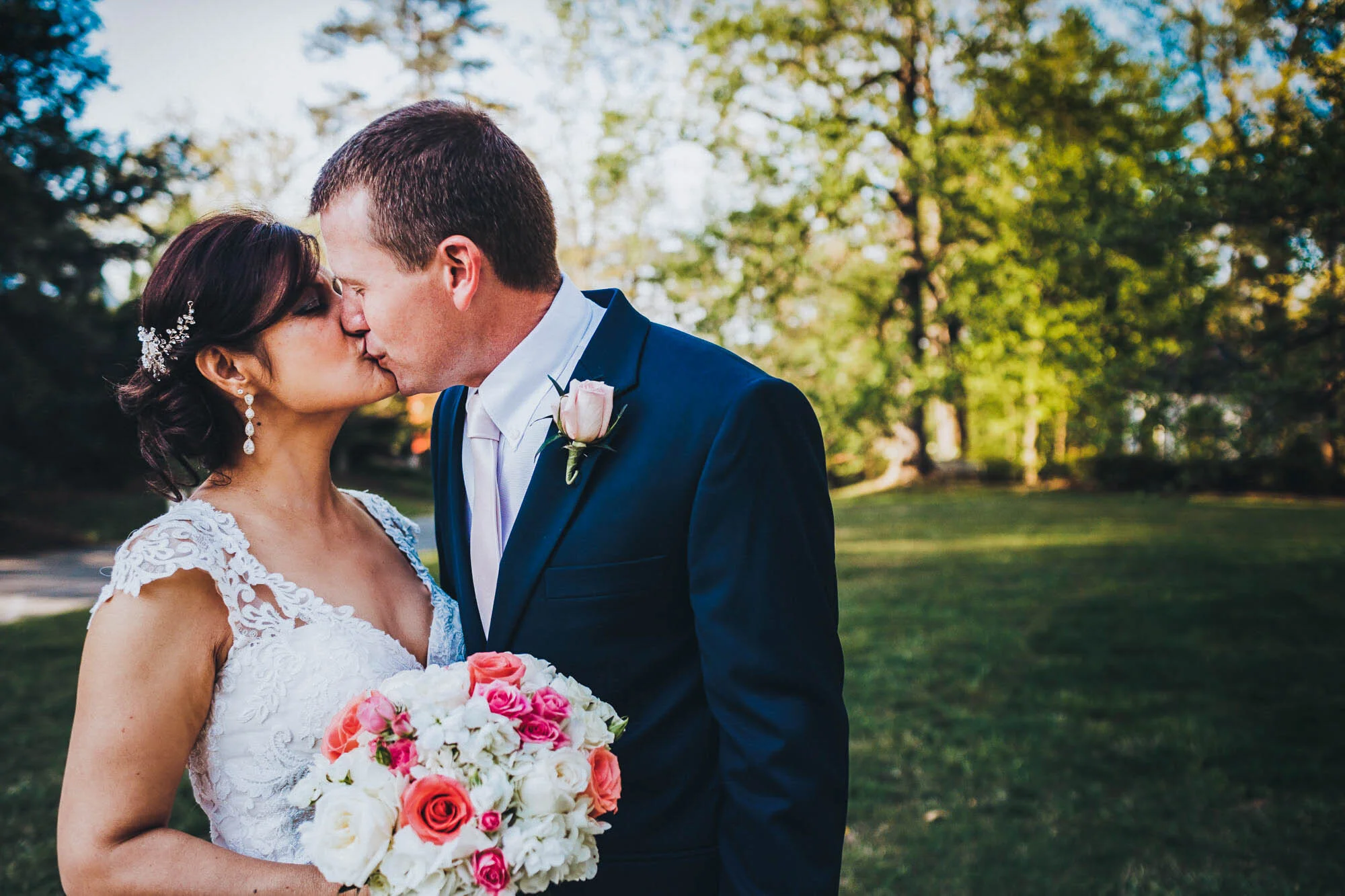 bride and groom kissing after wedding.jpg